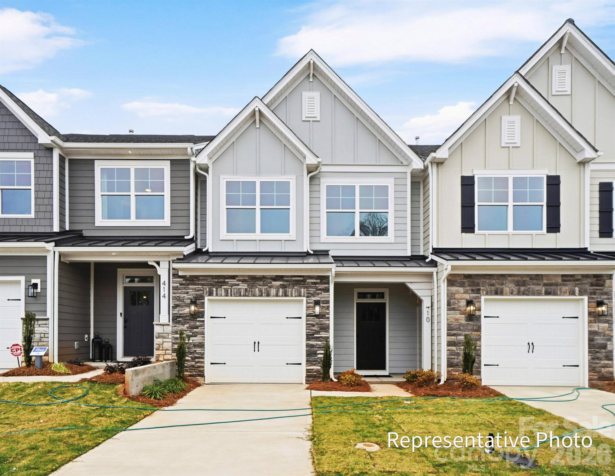 New townhomes in the heart of Waxhaw! This Ashland plan has 3 bedrooms, 2.5 baths, and more than 1,800 square feet of living space. Enter the home through the foyer with tray ceiling and Craftsman-style trim to see the open kitchen, dining area and family room that walks out to a covered porch. The kitchen features gray, Shaker-style cabinets and white quartz counters, a spacious island, tile backsplash, and stainless appliances, including a gas range. The open main floor has beautiful and durable Enhanced Vinyl Plank flooring throughout. The upper floor has the loft, bedrooms, two full baths and laundry room. The primary bath has a tiled shower with semi-frameless door and bench seat, dual-sink vanity, and linen closet. The upstairs full bath has a tub/shower combo. All baths feature gray cabinetry and white quartz counters. Walking distance to shops, eateries, and other conveniences. Visit today!