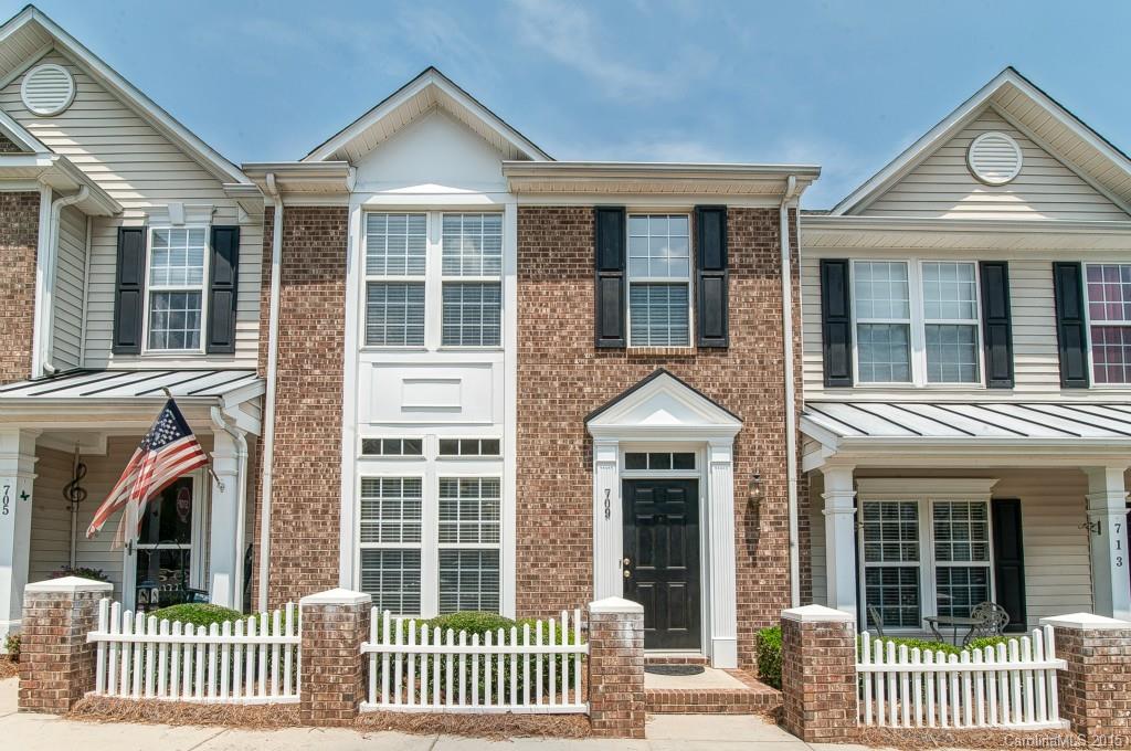 Well maintained and move-in ready Townhome in fantastic location! Walk to shopping, restaurants, movie theater and more! Spacious bedrooms and full bathrooms. Huge kitchen with large island...the perfect place for entertaining with friends. Home backs up to greenspace and rear of home is semi fenced offering nice privacy. Convenient to I-77, this townhome has it all, at a very affordable price!