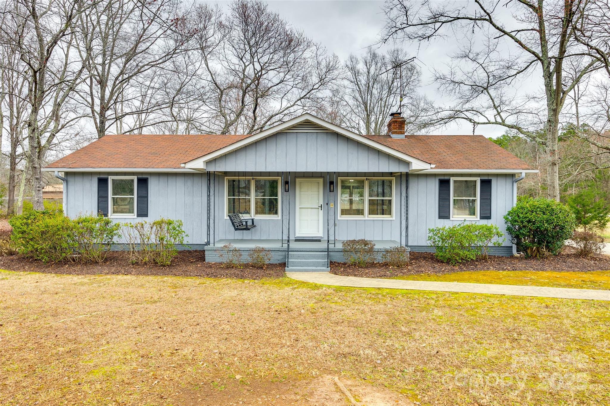 Enjoy 2.5+ acres from this solid ranch home's front or back porch. Two large garage/shop areas with power are perfect for the craftsman, woodworker, or car lover. Fresh paint and new vinyl plank flooring throughout the home with lots of updates including new lighting. The kitchen is light and bright, with a refrigerator, stove, dishwasher, and microwave included. This home is ready to move in! Private country setting but close to restaurants and shopping in Lake Wylie. No HOA. Award-winning Clover schools.