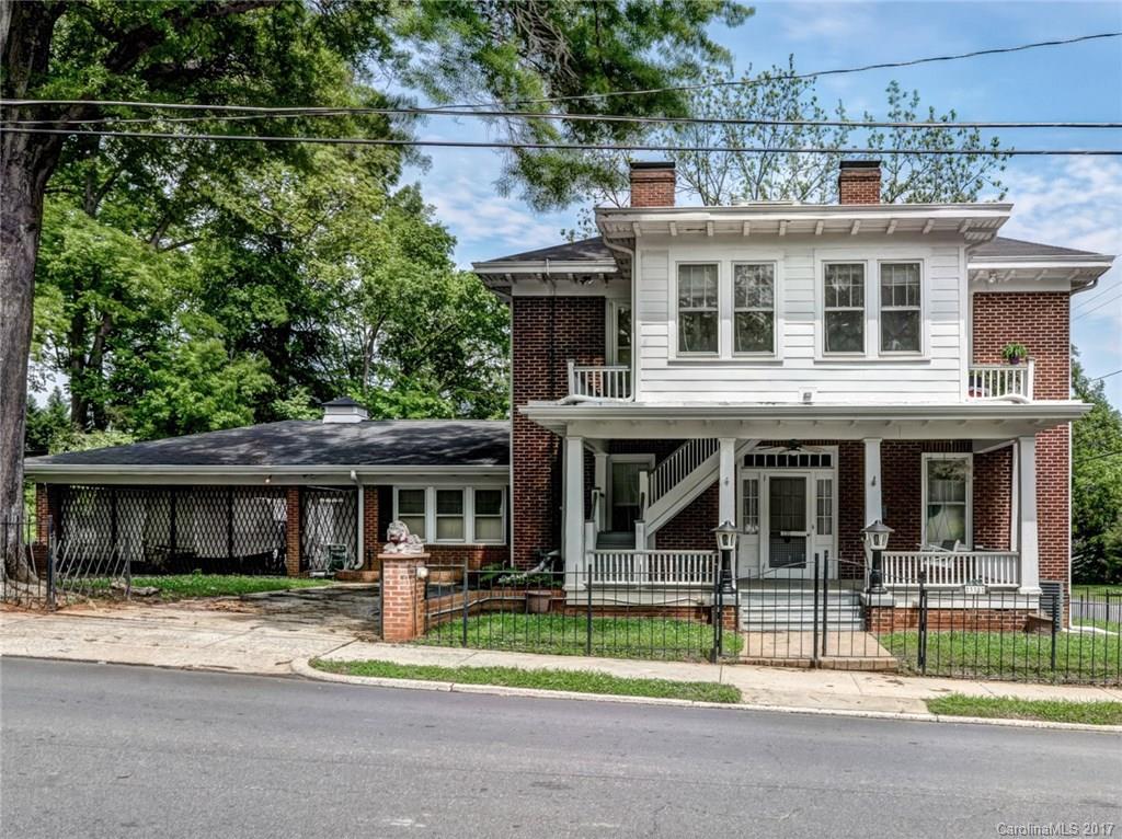 Prepare to be impressed! This is your chance to own a timeless beauty in the Historic District! Beautiful hardwoods grace most of the main and upper levels. Enjoy those Carolina sunsets on the front porch swing and balconies. House features two kitchens and laundry areas. Full basement has large rec room and full bath. Charming and unique is what you will find in this classic home!