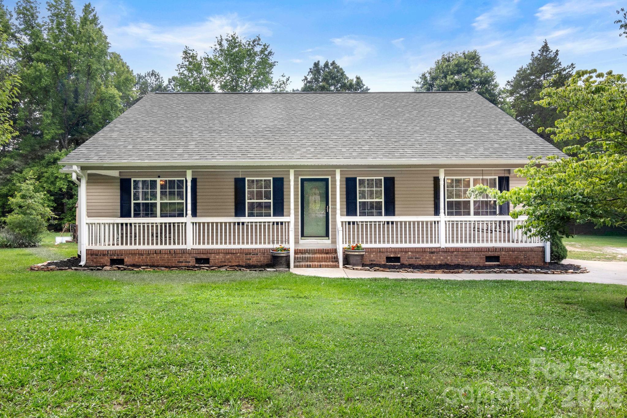 Welcome home to timeless Southern charm in the heart of historic York, SC! This inviting home on nearly one acre features a welcoming front porch, perfect for enjoying your morning coffee or relaxing evenings. Inside, you'll find beautiful hardwood floors, fresh paint, and an open floor plan designed for comfortable living and effortless entertaining.

The desirable split-bedroom layout offers privacy for the primary suite while providing ample space for family and guests. Updated bathrooms add modern appeal, and major improvements have already been completed with a new roof and new HVAC system installed in 2024.

Outside you will find a fenced portion of the backyard-- ideal for pets, play, or gardening--along with a spacious patio that's perfect for grilling, gathering, and outdoor entertaining and an unfenced portion perfect for enjoying the firepit and plenty of room for play.

Conveniently located in beautiful historic York, SC, this home offers easy access to local shopping, dining, and everything this charming community has to offer. Don't miss your opportunity to own a move-in-ready home that combines classic Southern character with modern updates!
