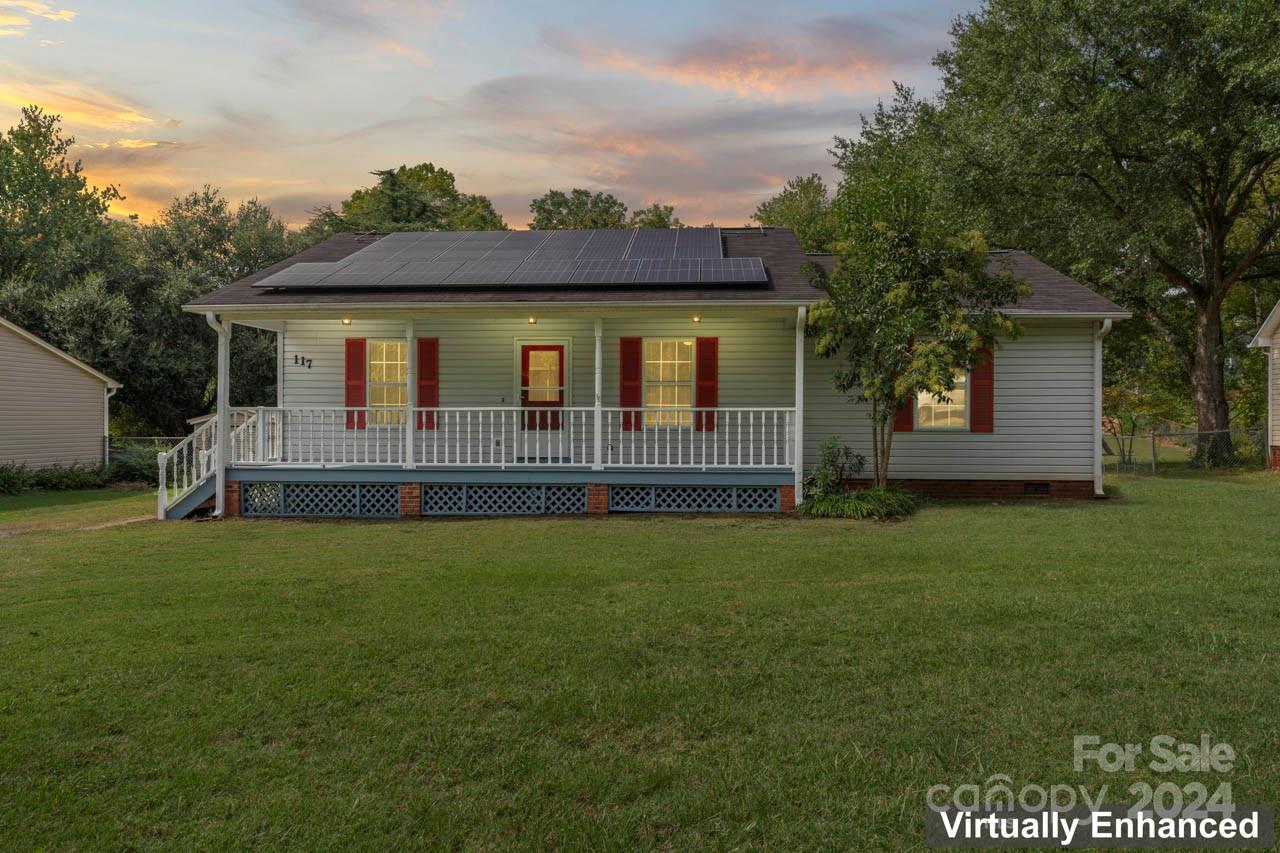 Charming 3-bedroom, 2-bath ranch with no HOA located in the heart of downtown Fort Mill, just a short distance from Main Street. Updates include new paint throughout, updated flooring and carpet, remodeled bathrooms, and solar panels for efficiency. This home is nestled in a quaint neighborhood that offers the perfect balance of proximity to downtown and peaceful, quiet streets away from the hustle and bustle of Fort Mill's downtown area. Inside, you'll find a spacious open-concept living area that includes a generous dining space, a cozy living room, and a well-appointed kitchen with ample cabinetry. Step outside and enjoy the freshly painted rocking chair front porch and backyard with abundant storage options, including a storage room attached to the home and an oversized shed. This home is conveniently located- near Walter Elisha Park, restaurants, boutiques Fort Mill's award winning schools, and I-77.
