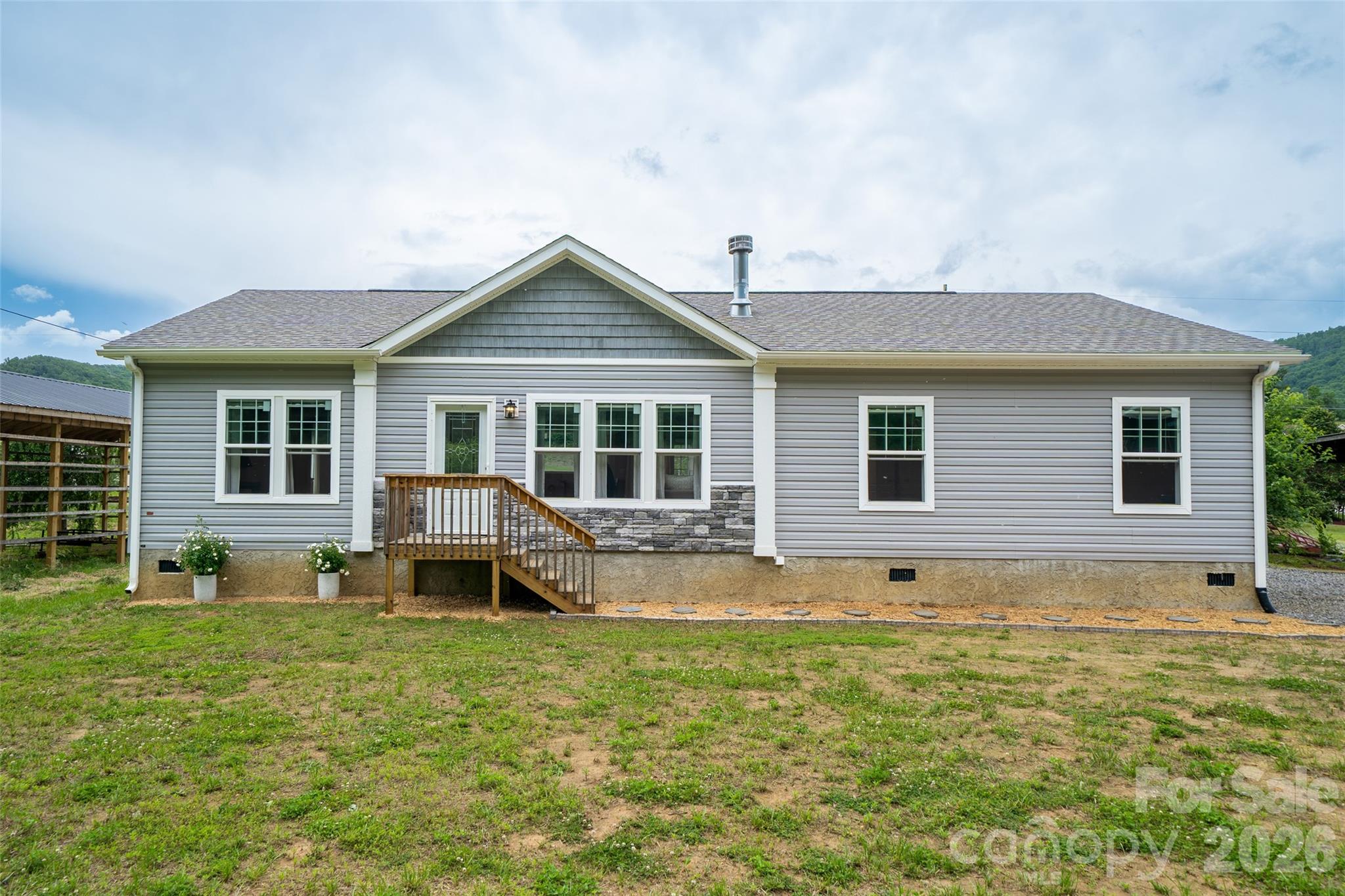 Prepare to be impressed by this beautifully upgraded 2023 manufactured home that combines modern design with everyday functionality. Lightly lived in, thoughtfully maintained, this home boasts 9-foot ceilings with elegant crown moulding, stylish barn doors, and drywall-finished walls that add a polished touch throughout. Open-concept layout  flooded with natural light, a kitchen with contemporary finishes, abundant cabinet space, and a walk-in pantry. The split-bedroom floor plan offers privacy and flexibility—perfect for families/roommates. A large, dedicated mudroom/laundry area provides a practical entry from the driveway, complete with a utility sink, built-in cabinetry, and ample counter space. Durable, low-maintenance flooring runs throughout, making everyday living a breeze. Located just minutes from Burnsville’s vibrant and growing downtown, offering comfort, convenience. A level yard with endless possibilities!