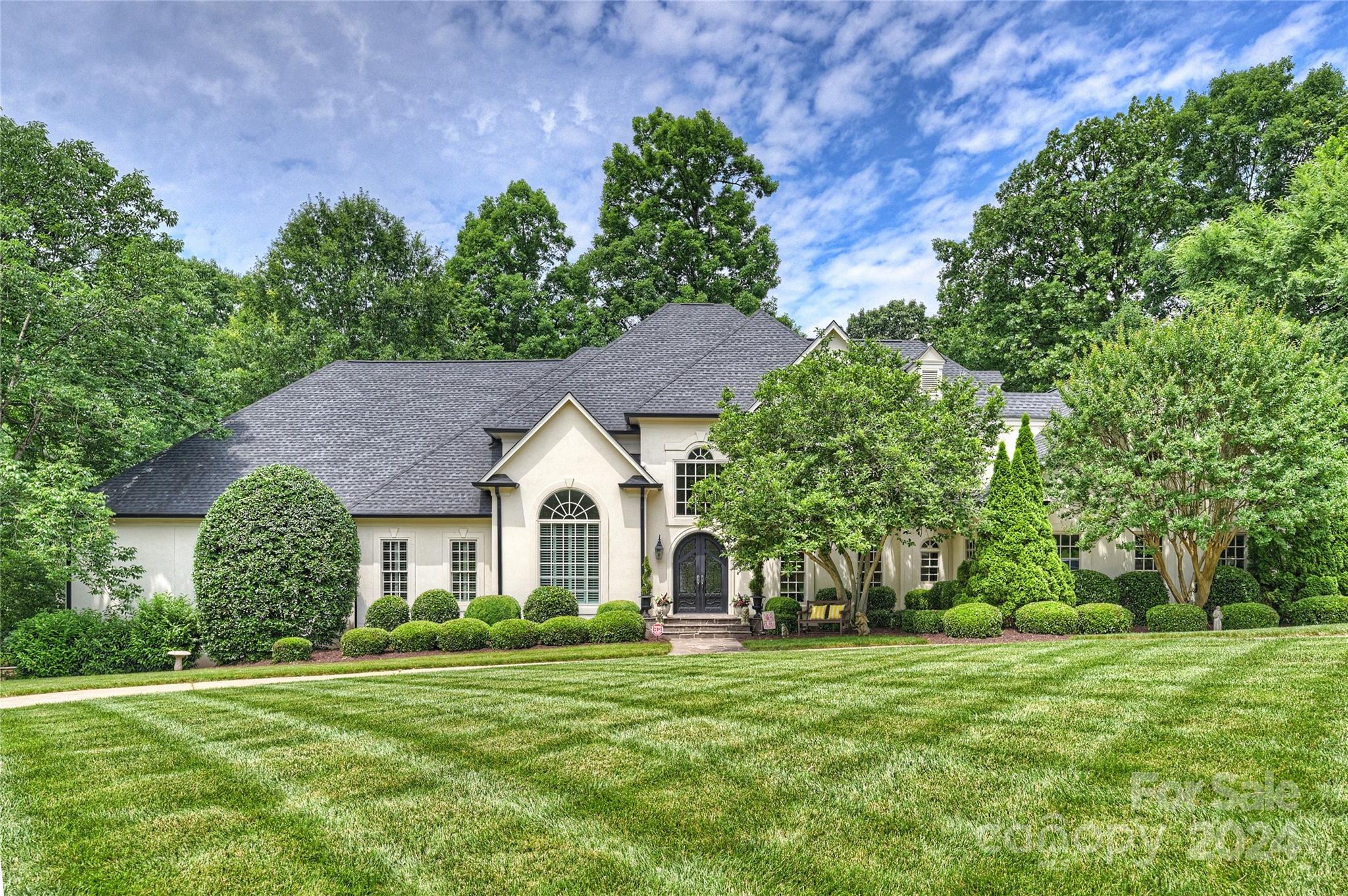Amazing opportunity to own this custom home in the Royden neighborhood. This large home features 5 bedrooms and 4 full and 2 half baths. The primary bedroom is located on the Main level and has his & hers walk-in closets. This home has something for everyone...Media Room with 100 inch projection TV, state of the art surround sound, and mini kitchen, Bonus Room, Office, elegant formals, Family Room, Sunroom, and expansive Wine Cellar. There are TWO 3 car garages; the lower 3 bay garage is heated and cooled and could be used as a workout room, or additional bonus room. The outdoor space gives prominence to the wood burning fireplace and built in Viking gas grill; as well as the pool with jetted spa and waterfall. The large deck overlooking the pool has a full outdoor bathroom that is perfect for rinsing off before or after a swim. 2 large attic spaces; one is a walk in attic, the other is a walk up attic with permanent stairs. Beautiful mature landscaping on a private, almost 1 acre lot.