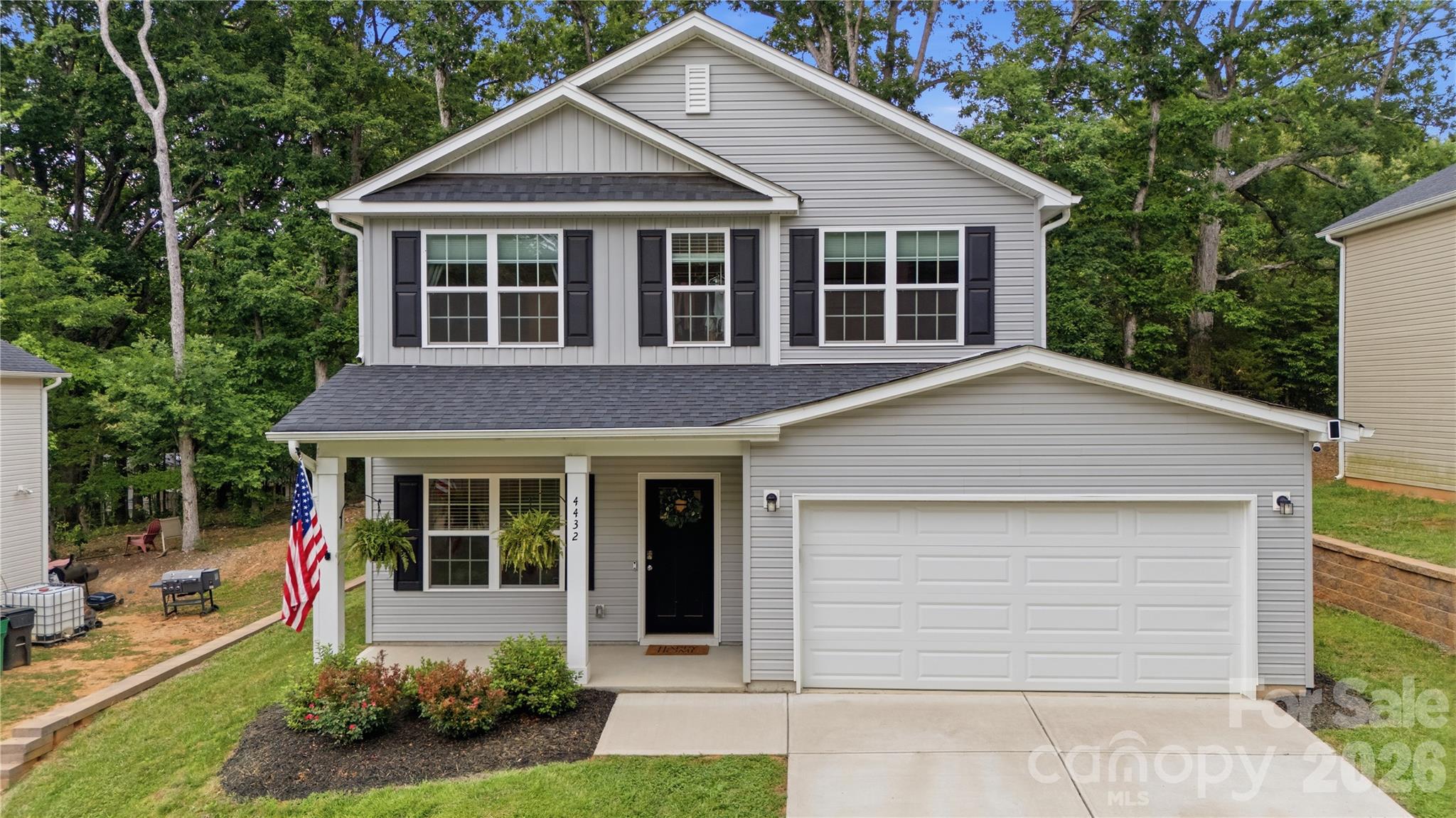 Built in 2023, but sitting on something you almost never get with a newer home — a private, fully fenced 0.44-acre lot shaded by mature hardwoods. Most new builds hand you a bare yard and an HOA. This one gives you established trees, finished landscaping, a patio, and no HOA at all. Inside, it lives like the day it was built. The main floor is open — a white shaker kitchen with granite counters, subway tile, stainless appliances, and an island and open floor plan. Wood laminate flooring runs throughout the main level, and board-and-batten accent walls in the dining area adding lots of character and charm. All four bedrooms are upstairs, so everyone's on one level. The primary has its own bath with a double granite vanity, and laundry room is on the same upper level. Downstairs, a sliding door opens to a patio and a backyard that's private — fenced, flat, and quiet. Location does the rest. You're minutes from I-485, putting Uptown Charlotte about 20 minutes out — close for the commute, far enough to breathe. Newer construction, a real wooded lot, and no HOA. That mix doesn't come up often. Come see it!