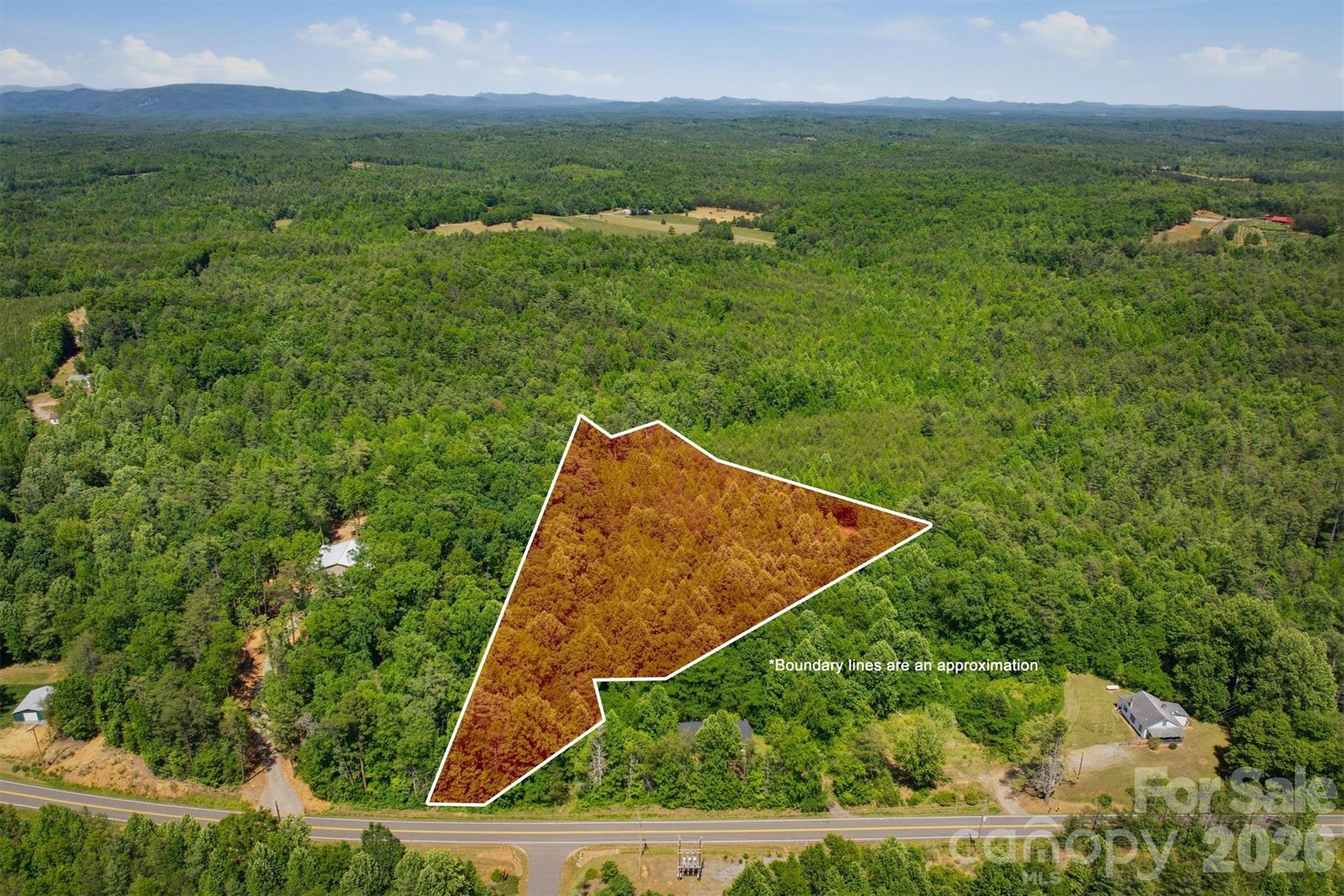 Beautiful and private 4-acre wooded tract near Lake James in the foothills of Western North Carolina. This residentially zoned (R-1) property in Burke County offers a peaceful setting with a cleared area that would make an ideal homesite surrounded by nature. Accessed from Highway 126 by a 24-foot deeded right-of-way, the property provides both convenience and seclusion. Well and septic will be needed. Scenic overlay and small corner is located in Conservation district.  A wonderful opportunity to build your mountain getaway or full-time residence near Lake James recreation, hiking, and outdoor activities.