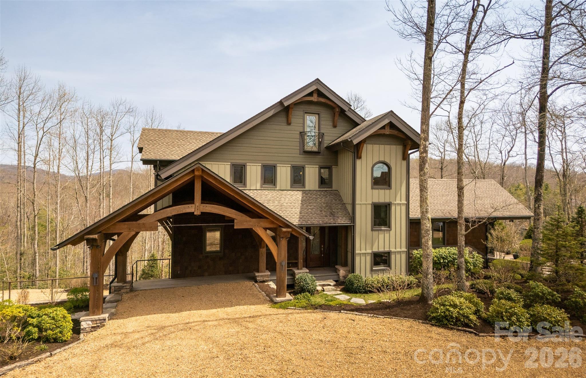 ENJOY ELEGANT MOUNTAIN LIVING WITH VERY VERY LOW ENERGY COSTS YEAR ROUND WITHIN THE DESIRABLE, GATED COMMUNITY OF SWEETGRASS, 10 MINUTES FROM DOWNTOWN BLOWING ROCK. Custom built home in one of the best and largest lots in Sweetgrass, complete with its own small pier on the lake. House is nestled in on the point, both overlooking the lake, the dam, and the national forest, and surrounded by tasteful landscaping designed by Sonya Garland. Indulge in the luxury of staying warm all winter with virtually “free heat”. THIS HOME IS BOTH HIGH-TECH and NET-ZERO/OFF-THE GRID. TYPICAL UTILITY COSTS PER YEAR IS ONLY $800 (with a usage rate of 2 long weekends per month, and multiple week-long stays throughout the year with many guests, and keeping it at 68 degrees in the winter while away.)

The thoughtful design makes this home “live” much bigger than what one would expect from the photos and its stated square footage. Open floorpan throughout but still feels cozy with the wood beams, warm cabinetry, and various living areas and flex space to cater to changing needs. Built-in sound system throughout the house. Primary bedroom and laundry on main floor, designed for retirement.

Enjoy virtually “free heat” via radiant floor heating throughout is served by solar thermal panels that provide all of the heat and hot water for the house. Complete with (2) 90-gal. storage tanks for hot water, you will never run out.  So much so, that the hot water overflow goes to the entire basement floor, keeping that level dry in the summer and warm in the winter. This makes it very comfortable for anyone working on hobbies or projects year-round. There is also a 500 gal propane tank and boiler as a backup for the heat, fireplaces, stovetop and grill connection on the deck.

This home has solar photovoltaic (PV) panels that provide electricity, as well as a brand new Tesla PW3 battery (with 13.6KWH capacity) that powers the emergency panel, (which is charged by the grid when the utility power is on, and the solar PV system when it is off.) 4 electrical panels in the house w/ one serving as an “emergency” panel that is connected to the battery (running the controls to the house, some lights, some items in the kitchen, and the home theatre.) Most of the lighting is LED downlighting with remote power supplies in 3 discrete locations.

This net-zero home is complete with an electric vehicle charger in the garage, making it virtually free to travel to/from your mountain retreat.

The home is operated by a Control 4 operating system, that can easily monitor and control many systems remotely via an app on your phone, or the tablet in the kitchen.  It can monitor, control, and design lighting and heating preferences, access the security system and cameras, door locks, music, TVs, home theatre, etc.

Spacious kitchen has lots of workspace, ample cabinetry, large island, and a walk-in pantry, w/ an excellent work flow to handle multiple chefs cooking in the kitchen at the same time. Living area boasts vaulted ceilings, a gas fireplace and overlooks to the lake. The screened-in porch also has vaulted ceilings, wood-burning fireplace (w/ a gas starter) with views of amazing sunrises, and wildlife grazing along the dam and creek.  The basement level has a large home theatre with a 4k projector, incredible sound system, tiered platforms for seating, and 8 powered reclining chairs.  Over-sized, heated 2-car garage, 2nd refrigerator, and workshop area, mechanical room, and extra storage closets.

At the center of the Sweetgrass community is a 22-acre private lake, suitable for canoeing, kayaking, swimming or fishing. It has approximately 3 miles of maintained hiking trails, making it a great place to walk dogs or get in a quick hike with friends without having to get in the car. There is access to trout-stoked Boone Fork Creek, and a community clubhouse with a fitness centers, gathering space, etc. Trail map is attached

House is being sold fully furnished.