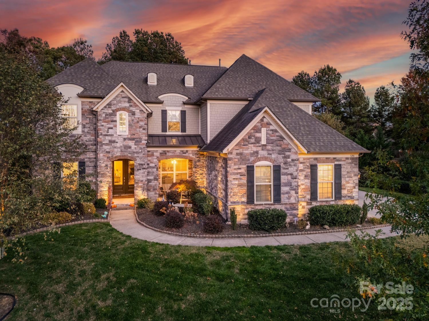 One of Bridgemill's finest! Don't miss out on this gorgeous former model home. Designed for entertaining & luxurious living featuring amazing architectural details throughout this 5BR & 7BA home! This truly exceptional home will exceed expectations. You’ll love the beautiful flooring, three-story stairwell,  rich moldings, plus tray & coffered ceilings. The covered front porch invites you into a bright & airy 2-story foyer flanked by formal dining room & office (currently used as a playroom) w/ French doors. Spacious great room features exquisite stone fireplace opening to a dining area and Gourmet kitchen w/ ss appliances, gas range, large granite island, butler's pantry, & computer niche/office. Main floor guest suite with private full bath. Upper level of this dream home provides luxurious Owner's suite w/ tray ceiling, sitting area, & spa-like bathroom. 3 additional BRs each w/ private bath, & family/flex room. The third floor offers a spacious family/media room w/ 1/2 bath. Relax and entertain on the spacious patio overlooking the private backyard, or head down to the community clubhouse, tennis courts, or pool to cool off! Newer plantation shutters, Nest home system, and wired ADT Security system convey!