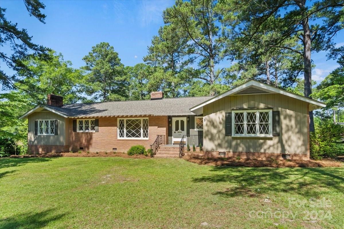 This home has recently undergone! It is not a traditional "flip."New roof with 30-year, architectural shingles, new Trane HVAC, refinished hardwood flooring, updated electrical outlets, quartz kitchen countertops, all new appliances, extensive bathroom renovations with beautiful vanities and new light fixtures throughout. Upon entry, you will be welcomed into a combined and open formal living/dining area, spacious den, and large kitchen, with "eat-in" dining. On the main floor are four bedrooms and two new bathrooms. The primary suite has great flex space which could serve as additional closet space, or a home office (3D renderings are available). An area off the kitchen has plenty of additional flex space (mudroom/pantry/storage) and a full bathroom. There is a walk-out basement with over 400 sq. ft. with fresh sheetrock throughout, heated and cooled with a modest toilet and shower. You can enjoy time on the wonderful patio, the updated landscaping, and a new driveway.