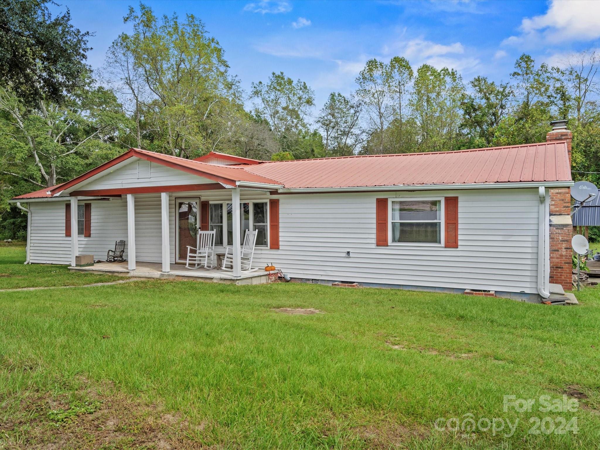 This sweet home, situated on approximately 2 acres just off of Hwy 52 S, has wonderful living space, transformed bathrooms and kitchen, new flooring throughout, and much more! In addition to the spacious, two-car garage, there is a sizable, finished room which could easily be converted into a myriad of uses. Out back, there is a nice patio area. Come take a look to see just how special this property is! Please note, the white building (outdoor kitchen) does NOT convey with the property.