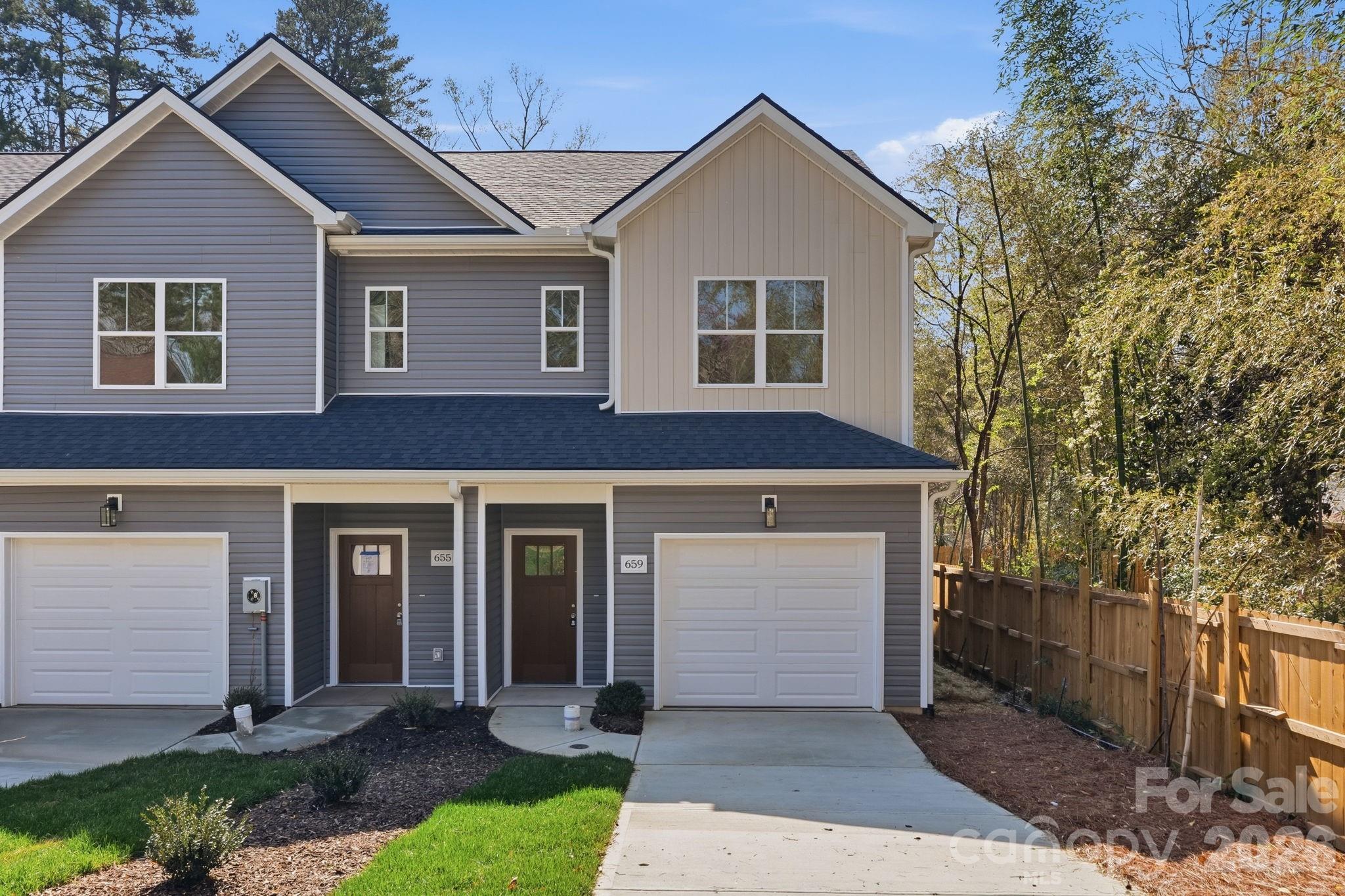 NOW OFFERED UNDER $300K! New construction end-unit townhome AVAILABLE NOW. This thoughtfully designed 3-bedroom, 2.5-bath home offers modern living space, plus a private driveway, a fully finished one-car garage, buried gutters, and a drainage system. The main level features durable LVP flooring throughout (NO CARPET), Level 3 quartz countertops, custom lighting and fixtures, and a bright open layout designed for comfortable everyday living and entertaining. The kitchen includes a full stainless steel appliance package (including refrigerator and microwave), a spacious pantry, crisp subway tile backsplash, abundant cabinetry, and a large island ideal for cooking and gathering. Upstairs includes three spacious bedrooms, including a comfortable primary suite, along with well-appointed bathrooms featuring upgraded vanities and modern finishes. LVP flooring continues throughout the upper level, providing a cohesive, low-maintenance living environment. The end-unit location provides additional natural light and separation, enhancing the overall feel of the home. Conveniently located near Uptown Charlotte, NoDa, Plaza Midwood, Charlotte Douglas International Airport, and the U.S. National Whitewater Center, with Gum Branch Greenway nearby. A preferred lender program is available for qualified PRIMARY RESIDENCE buyers, offering up to $10,000 toward closing costs, rate buydown, or down payment with NO PMI. Virtually staged photos illustrate the layout, space potential, and a backyard designed for outdoor living inspiration. Offers a strong combination of layout, finishes, and value within the community.