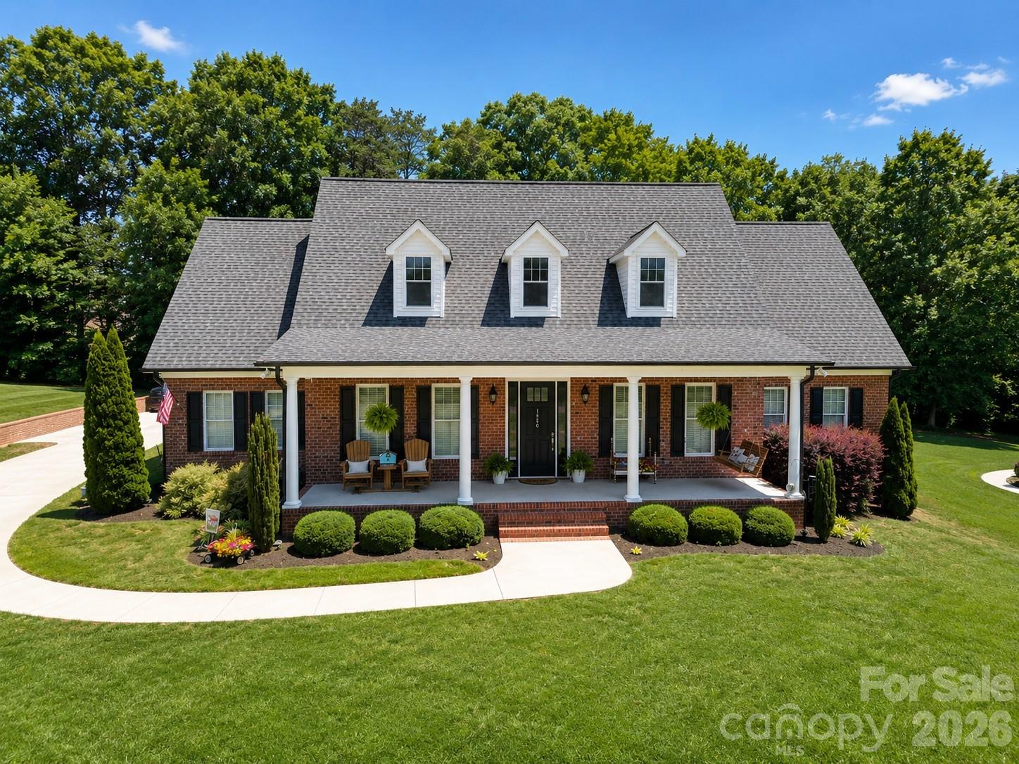 This isn't just a house. It's the life you've been looking for.
Nestled in one of the area's most desirable neighborhoods, this impressive all-brick home offers over 3,200 square feet of thoughtfully designed living space with soaring 10-foot ceilings, abundant natural light, and a flexible floor plan that adapts beautifully to your needs. Multiple room configurations provide options for additional bedrooms, home offices, hobby spaces, or guest accommodations.

The stunning windows fill the home with sunshine, highlighting the rich hardwood floors that flow throughout the main living areas. At the heart of the home, spacious gathering areas invite everything from quiet evenings to memorable celebrations. Even the laundry room is a standout space you'll actually enjoy spending time in.

The primary suite serves as a true retreat, offering the comfort and privacy needed to unwind after a busy day. Outside, the screened porch creates the perfect setting for cool summer evenings, morning coffee, or simply enjoying the peaceful surroundings. A fenced backyard provides space for outdoor enjoyment, while abundant storage options throughout the home help keep life organized.

Beyond the property itself, the location is exceptional. Enjoy low Lincoln County taxes, sought-after neighborhood schools, easy access to Lake Norman, and a Charlotte commute of less than 30 minutes. Spend weekends exploring the charm of downtown Lincolnton, dining and shopping in Denver, or enjoying the countless recreational opportunities that make this region so desirable.

This is more than a beautiful home—it's a place to gather, relax, celebrate, and create lasting memories for years to come.