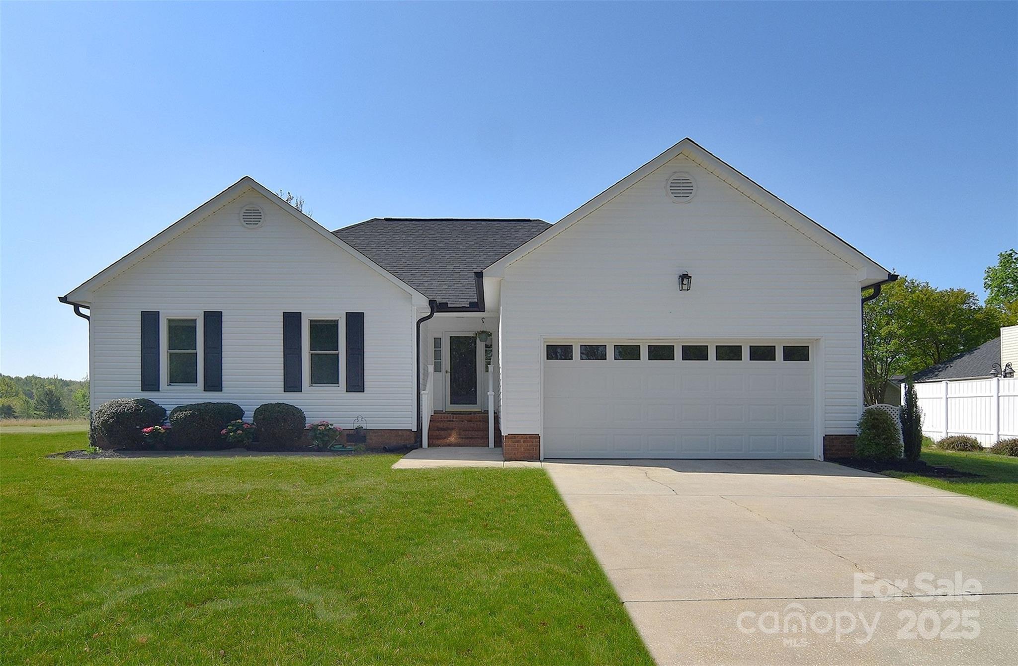 Wow, this bright and cheery home is waiting for its new owner. 3 bedroom 2 bath home on private fenced yard with deck. Open floor plan with lots of natural light. Cozy great room with vaulted ceiling and gas fireplace.  Kitchen eating area with large window .Laminate flooring throughout NO Carpet!. washer and dryer to remain. New roof 2024, new AC 2024. New gutters, windows approx 3 years old. New dishwasher