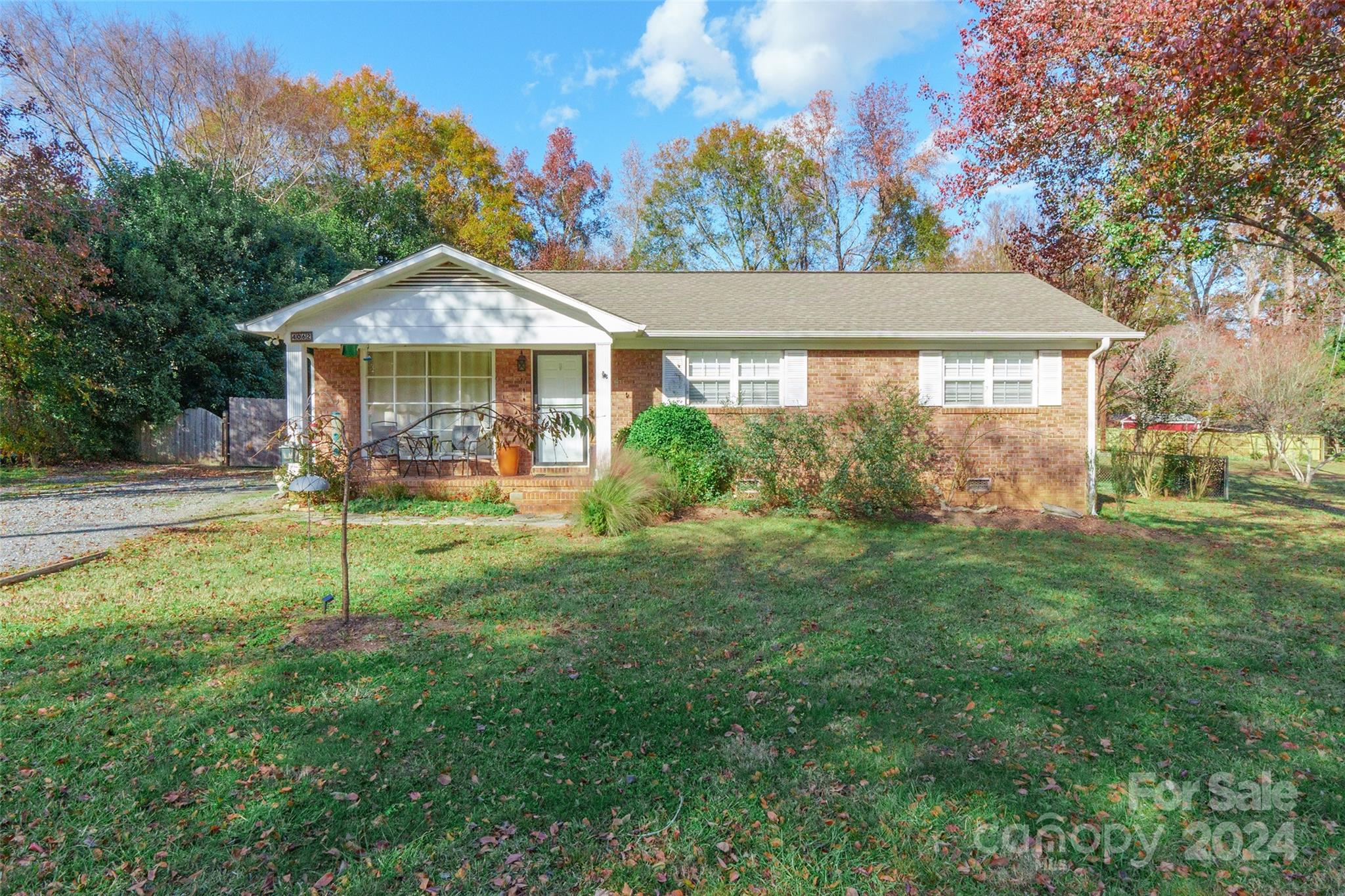 This charming, move-in-ready all-brick home is a true gem, offering the perfect blend of comfort and convenience with no HOA. Located just moments from Ebenezer Park and its public boat launch to Lake Wylie, this home boasts a nearly half-acre, flat, private backyard, ideal for outdoor activities. Inside, enjoy spacious living with hardwood laminate flooring throughout, plenty of natural light from the bay window in the family room, and updated finishes in the kitchen, including white cabinetry, granite countertops, a stylish tile backsplash, and stainless steel appliances. The master suite features his-and-her closets, and additional storage is provided by a detached shed with a one-car garage. This home is a must-see!