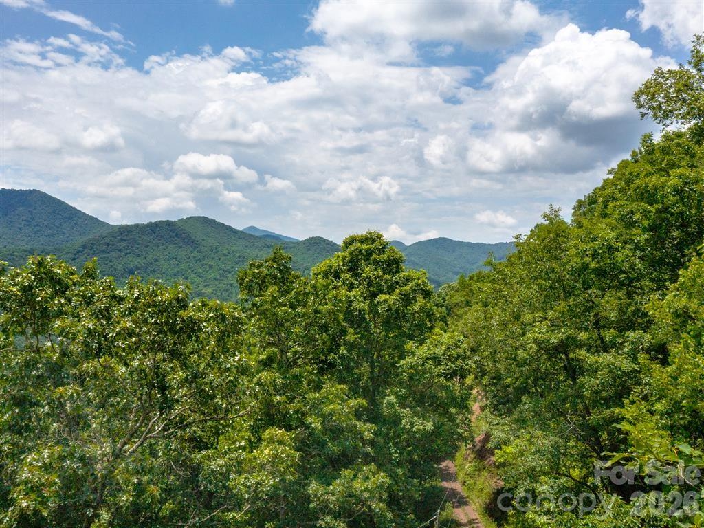 2700+ FT Elevation - CRAZY Beautiful Views - W/ WELL (water) in place, power was connected when used for CAMPING W/TWO STORAGE "SHEDS"! (*not actively connected)! 2 Lots included, and just a portion of more available!... yours to choose a building site or sell one?! A great price for the options! W/roads in place to the lots, several homesite options offer the potential of 180+ degree mountain views on some! Create the playground you have always dreamed of yet being conveniently located near the HWY for quick access to the Casino for a night of entertainment or town- dining, shopping, gas! NO drive by w/o appt. Privacy near the Nantahala, too - camping, fishing, hunting, mountain biking, lounging, yoga, photography... This is a portion of 2 sets of lots under the same parcel number. Call/text for a showing!