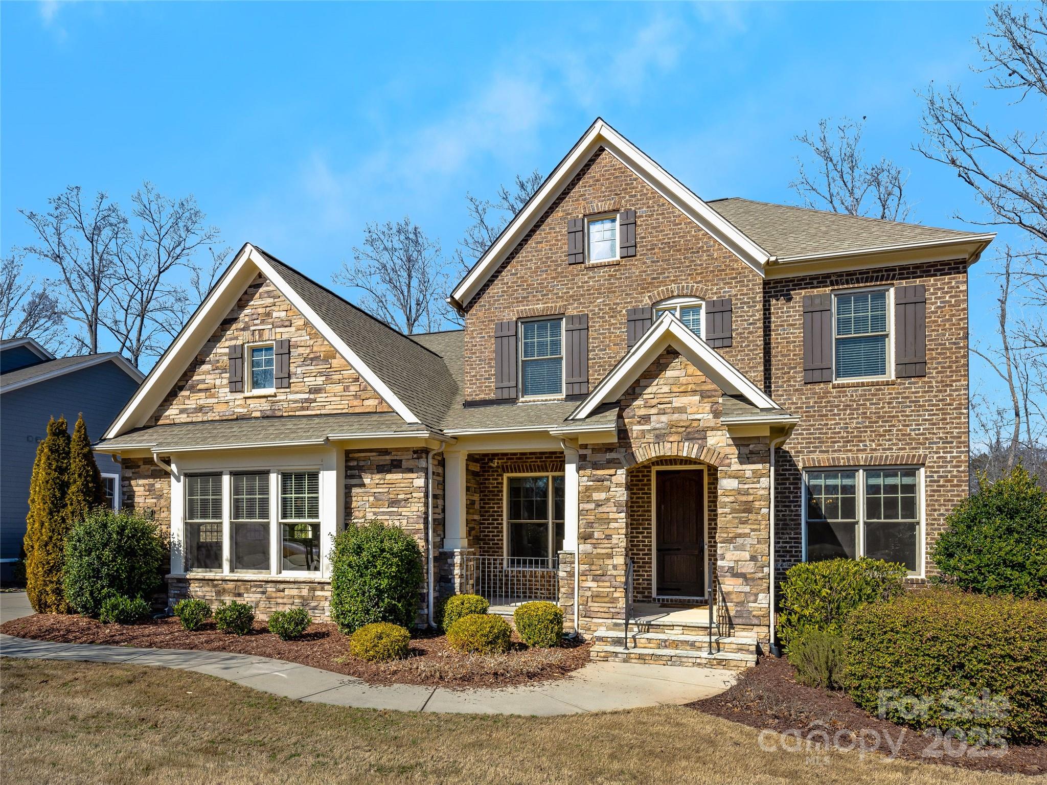 Beautiful, full brick cut de sac property is located on the 7th fairway in the sought after Springfield. Community features include golf course, rec center with club house, tennis & pickle ball courts; sidewalks.  The home offers a range of living spaces both inside and out - a spacious formal dining room, a large waterfall marble island, a full outdoor kitchen, patio & hot tub. Lots of natural light, brick feature wall, beamed ceilings,upstairs den plus bonus, screen porch w/FP- all add to the spacious living. Greatroom & FP overlook screen porch, bkf. & kitchen. Primary suite on main features beamed ceiling, outdoor views & massive bath adjoining custom closet. Cook's kitchen built for convenience, planned for entertaining. Updated lighting. Upstairs large loft den connects to 3 BR & huge bonus/flex space. Wonderful location on cul de sac street.  Fort Mill Schools!