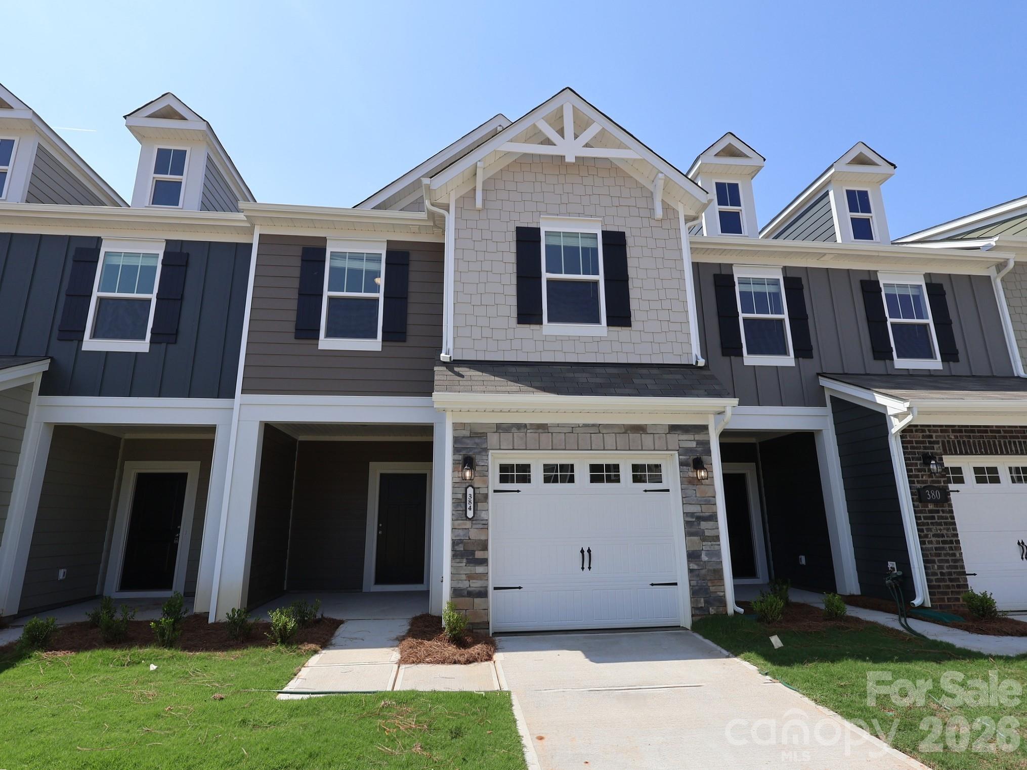 Welcome to the Manchester! Walk in straight from your front covered porch and embrace the homey feel of your foyer. Through the foyer you'll be greeted with a spacious kitchen, with an island for more space to cook and entertain. Equipped with stainless steel appliances, side-by-side refrigerator and a kitchen island with a sink, you'll feel like a chef! With our open floorplan, you have easy access to the family room to enjoy conversation and quality time. With enough space to easily fit a sectional, coffee table and other furniture, the family room is the perfect spot to unwind. Through the sliding glass door is a private patio, perfect for entertaining or enjoying a morning coffee. You'll notice throughout the main level is easily maintainable EVP flooring to make cleaning a breeze and windows throughout the home have been accented with 2" faux wood blinds. Take the staircase to the upper level, where you'll find the spacious owners bedroom with ensuite to ensure privacy and comfort. You will also find two additional bedrooms, perfect for guests or the little ones. The secondary bath is easily accessible to the additional bedrooms to ensure everyone is satisfied. Finally, you get to enjoy the ease of same-level laundry access, complete with a full size washer and dryer to make laundry days flow easily.