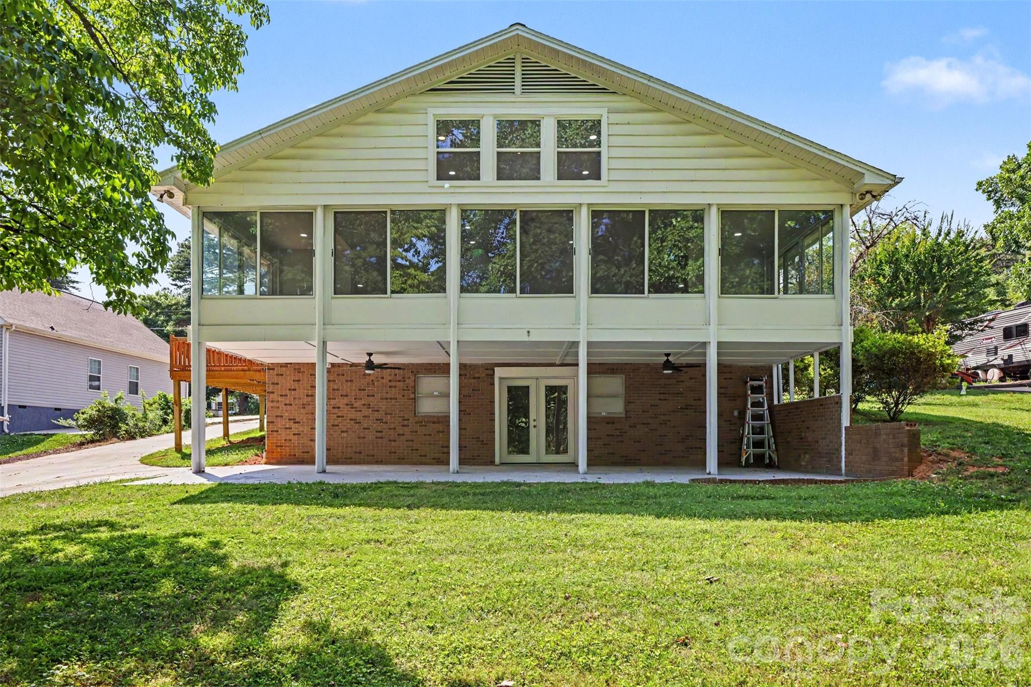 Discover the perfect blend of modern updates and lakefront living in this beautifully updated waterfront home on Lake Norman. Nestled on a deep-water cove with year-round water access, this property features a private boat ramp, making it easy to enjoy boating, kayaking, paddleboarding, fishing, and everything lake life has to offer.

Step inside to a stunning family room with soaring vaulted ceilings and an open-concept design that creates a bright, spacious feel. Expansive windows fill the home with natural light while showcasing peaceful water views. The kitchen flows seamlessly into the living and dining areas, creating an inviting space for entertaining or everyday living.

Outdoor living is just as impressive, with multiple areas to relax, gather with friends, or simply take in the tranquil setting. Enjoy your morning coffee overlooking the water, spend the day on the lake, and unwind with breathtaking sunsets from your own backyard.

The home offers numerous modern updates and flexible living spaces to suit a variety of lifestyles. Whether you're searching for a full-time residence, weekend getaway, or investment opportunity, this property offers the perfect combination of comfort, charm, and waterfront living.

Conveniently located near marinas, waterfront dining, shopping, and major highways, you'll enjoy the ideal balance of privacy and convenience.

Don't miss this rare opportunity to own an updated waterfront home with deep water, a private boat ramp, and endless possibilities on beautiful Lake Norman.