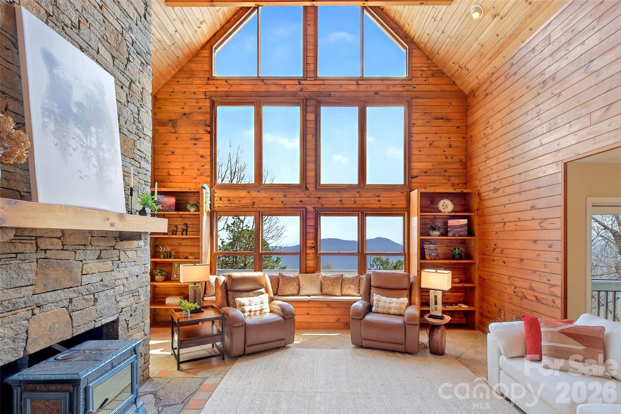 This impressive mountain home offers year-round mountain and Lake Lure views, along with so many desirable features that you truly must see it in person to experience it all. The great room showcases a lofty A-frame cedar ceiling that perfectly frames the long-range mountain views.

You’ll love the Tuscan-inspired kitchen, featuring cherry cabinetry, leathered Brazilian granite countertops, a live-edge island, abundant storage, built-in appliances, and lighted display features.

**MAIN FLOOR LIVING!** The laundry and primary bedroom are conveniently located on the main floor—and yes, both the bedroom and bathroom offer stunning long-range views. The primary suite includes his-and-hers walk-in closets and an en suite bathroom featuring a walk-in tiled shower and unique, locally crafted hand-thrown pottery sinks that highlight the region’s rich artisan culture and craftsmanship. Enjoy the large screened-in porch just off the primary bedroom. With mountain views from nearly every room, this home truly brings the beauty of the outdoors inside.

Upstairs, you’ll find two spacious, light-filled bedrooms, along with a large shared bathroom featuring a walk-in shower finished by a local artisan.

Need more space? No problem! The unfinished basement is already plumbed for an additional bathroom and offers ample room to expand, with ceilings mostly over 8 feet high (except at duct work). With its own separate entrance and driveway, it’s ideal for creating a private guest suite or additional living quarters.

Come experience breathtaking long-range mountain views from east to west and fall in love! Start your mornings with stunning sunrises and unwind each evening with unforgettable sunsets—all from the comfort of your own private mountain retreat in a gated community just east of Asheville. This community sits well above the floodplain while offering exceptional views and privacy.

Conveniently located near:

* 19 minutes to Old Fort
* 28 minutes to Black Mountain
* 40 minutes to Asheville
* 39 minutes to Lake Lure
* 1 hour to Hendersonville
* 1 hour 25 minutes to Spartanburg, SC
* 1 hour 42 minutes to Boone
* 2 hours to Charlotte
* 2 hours 30 minutes to Pigeon Forge, TN
* 6 hours 37 minutes to Jacksonville, FL

The backyard is mostly fenced and thoughtfully designed with a variety of native trees and seasonal blooms. You’ll also find walking trails, terraced beds with low-maintenance perennials, and flowering shrubs—perfect for enjoying the outdoors year-round. NO MOWING A BIG YARD!

While visiting, be sure to explore the community amenities in Gateway Mountain, including Waterfall Park and Lake George, connected by scenic hiking trails. Finish your day with a trip into Old Fort, where you’ll find local dining, live music, art, and more. Western North Carolina offers popular destinations such as the Biltmore Estate, Blue Ridge Parkway, Mount Mitchell (the highest peak on the East Coast), Grandfather Mountain, the Appalachian Trail, and so much more. This community is a great basecamp for outdoor adventures just minutes away.

Short-term rentals are allowed in Gateway Mountain, and its central location makes this property an ideal full-time residence, second home, or investment opportunity. *Note:* The purchase includes an additional lot providing privacy and potential build site if desired. Newer furnishings and housewares may be included for a turnkey option or removed at the buyer’s preference.