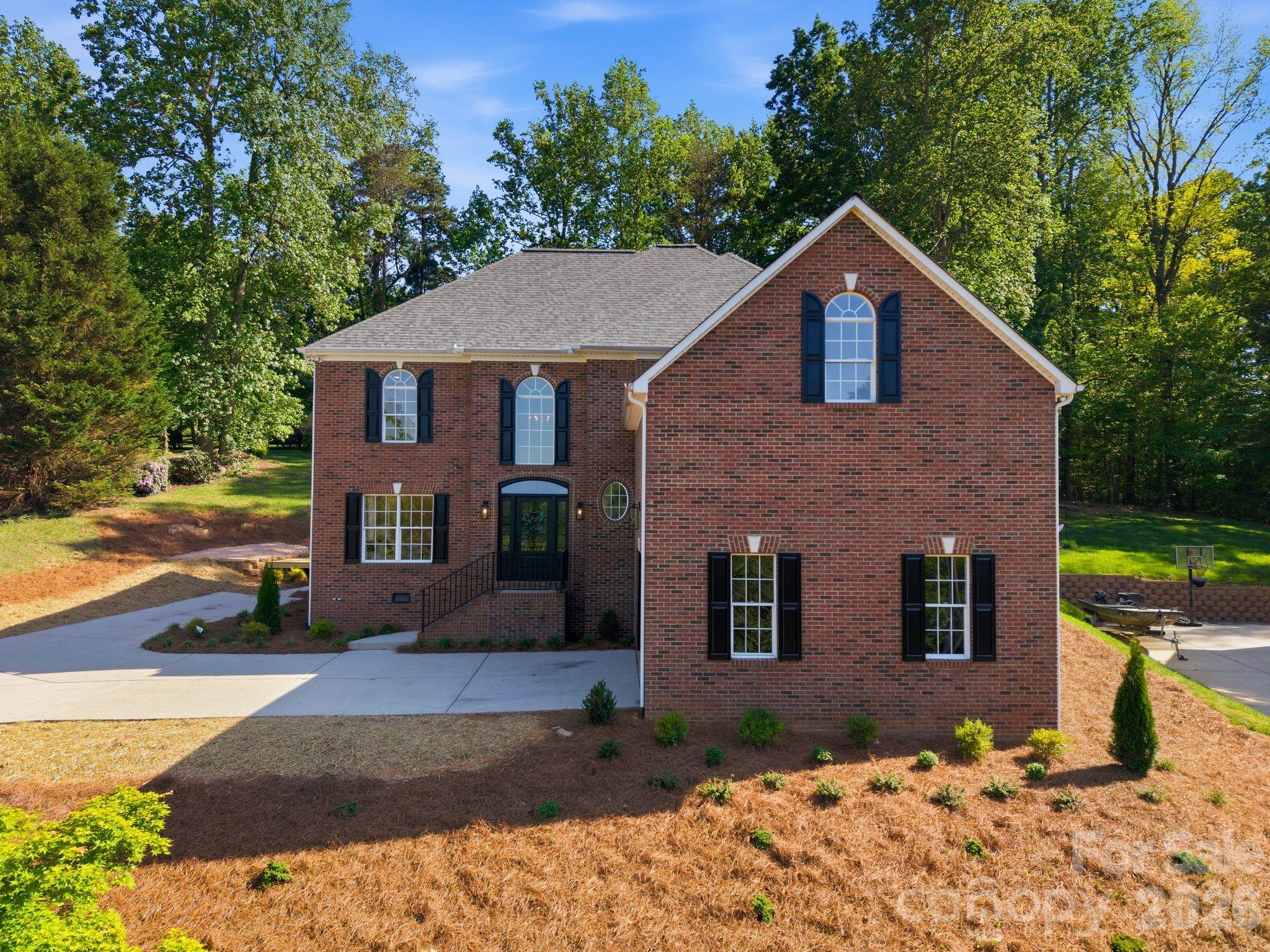 DREAMS DO COME TRUE! LAKE NORMAN LIFESTYLE AT AN AFFORDABLE $

Taken down to the studs and completely reimagined by Chad Goodin Signature Homes, this home is a showcase of craftsmanship, confidence, and character. * WATER VIEW of Lake Norman * DEEDED BOAT SLIP * community pool and tennis * nestled on over a half-acre. From the oversized kitchen island to the soaring living spaces and spa-like primary bath, every inch was thoughtfully designed to feel elevated, timeless, and lived in all at once.

Major updates include all new hardwood floors, quartz countertops, custom cabinets, all new Bosch appliances, designer fixtures, a new roof (2025), refined trim work, and custom closets. A main-level guest suite with a private bath offers comfort and privacy for visitors. The second-level features a spacious second bedroom with an attached jack-and-jill bath, leading to a large bonus room which features it’s own walk-in closet and seasonal water-views.

The Primary suite features a spa-like experience with a sprawling dual-vanity, smart mirrors, freestanding soaking tub, and an elegant frameless glass shower. Primary closet is complete with its own island, custom shelving, and tailored storage. Deeded boat slip is just a short walk away. Don’t miss the opportunity to have easy lake access without the waterfront price!