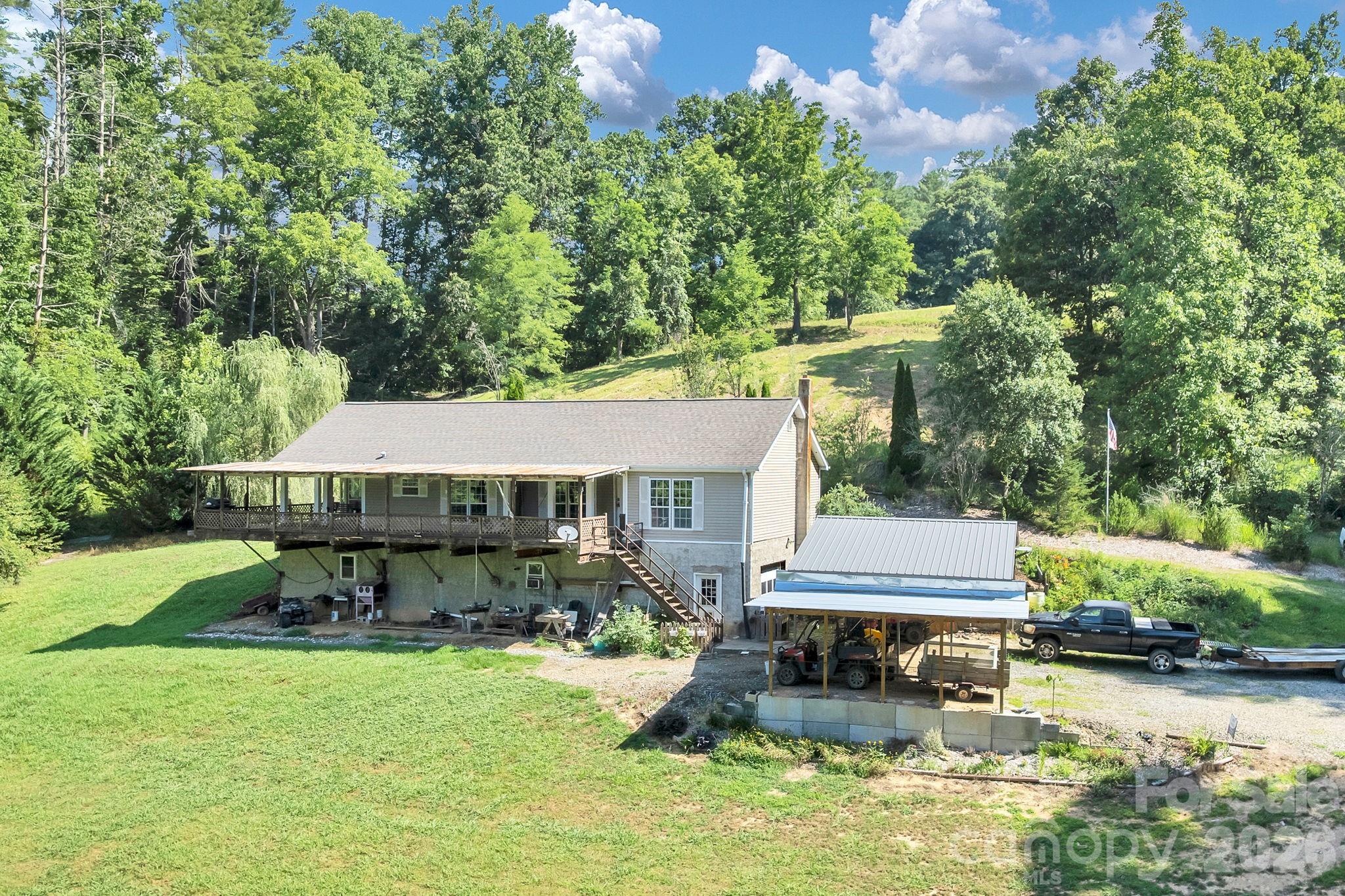 Escape to the peace and privacy of country living with this charming off-frame modular home nestled on 10.37 acres. A huge covered front porch welcomes you and provides the perfect place to relax with your morning coffee, unwind in the evenings, or simply enjoy the surrounding countryside and abundant wildlife.
Inside the home offers comfortable living spaces filled with some natural light and the warmth of rural charm. Beneath the home, you'll find an exceptionally solid basement workshop offering ample space for woodworking, hobbies, storage, or a home based business. Its sturdy construction provides endless possibilities for projects and practical use.
The expansive 10.37 acre property offers plenty of room for gardening, recreation, livestock, or creating your own private homestead as well as other building spots for a family compound. Whether you are looking for a peaceful retreat, a mini farm or a simply room to roam, this property delivers the best of country living while offering privacy, functionality, and the opportunity to make it your own. Needs some cosmetic love but the possibilities are endless. 
Seller says there is an additional 10 to 12 acres with a large workshop that has power, water and septic as well as a pole barn with bays available at an additional price.



Don't miss this opportunity to own a versatile country property where wide-open spaces, a welcoming front porch, and a substantial workshop area come together to create a perfect place to call home.