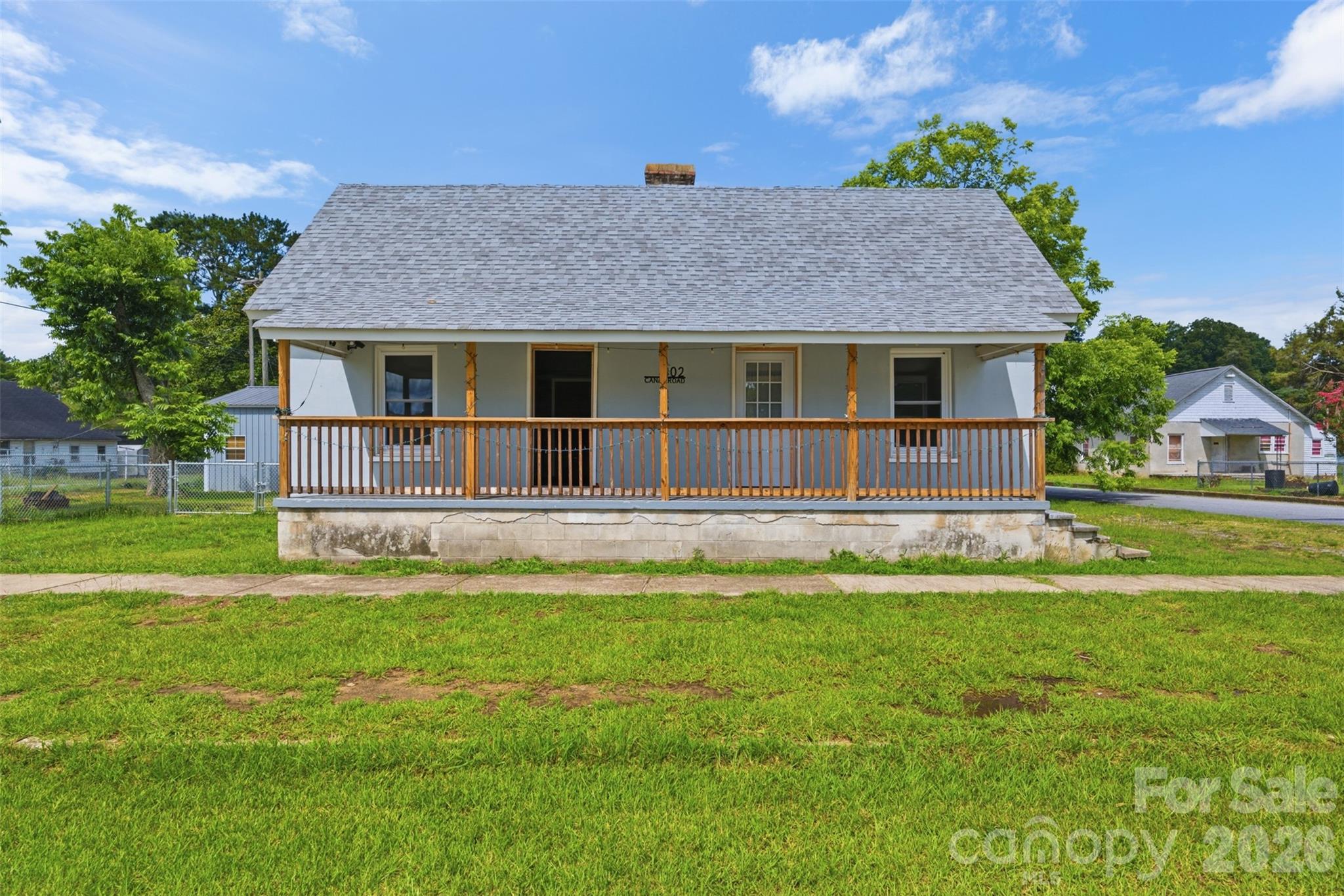 Roomy home on a corner lot across from the Broad River Canal in Lockhart, SC. Lockhart, SC sits along the Broad River in northeastern Union County SC near the Chester County line. The property features large rooms, mature pecan trees, a fenced yard, usable side yard space, and a detached 20' x 30' metal garage.

Purchased as a major renovation project in 2023, this home has undergone an extensive transformation. Improvements include a new roof, replacement windows, updated electrical service, extensive new wiring, all-new plumbing including water and sewer lines, a completely renovated kitchen, renovated front bath, added rear bath, tankless water heater, new flooring, attic insulation, detached garage, deck, and numerous additional updates throughout. While a few cosmetic projects remain, much of the heavy lifting has already been completed, creating an opportunity to own a home with significant system upgrades already in place.
A great opportunity for a buyer looking for space, recent updates, and the ability to add their own finishing touches.

Conveniently located near the Broad River and outdoor recreation opportunities.