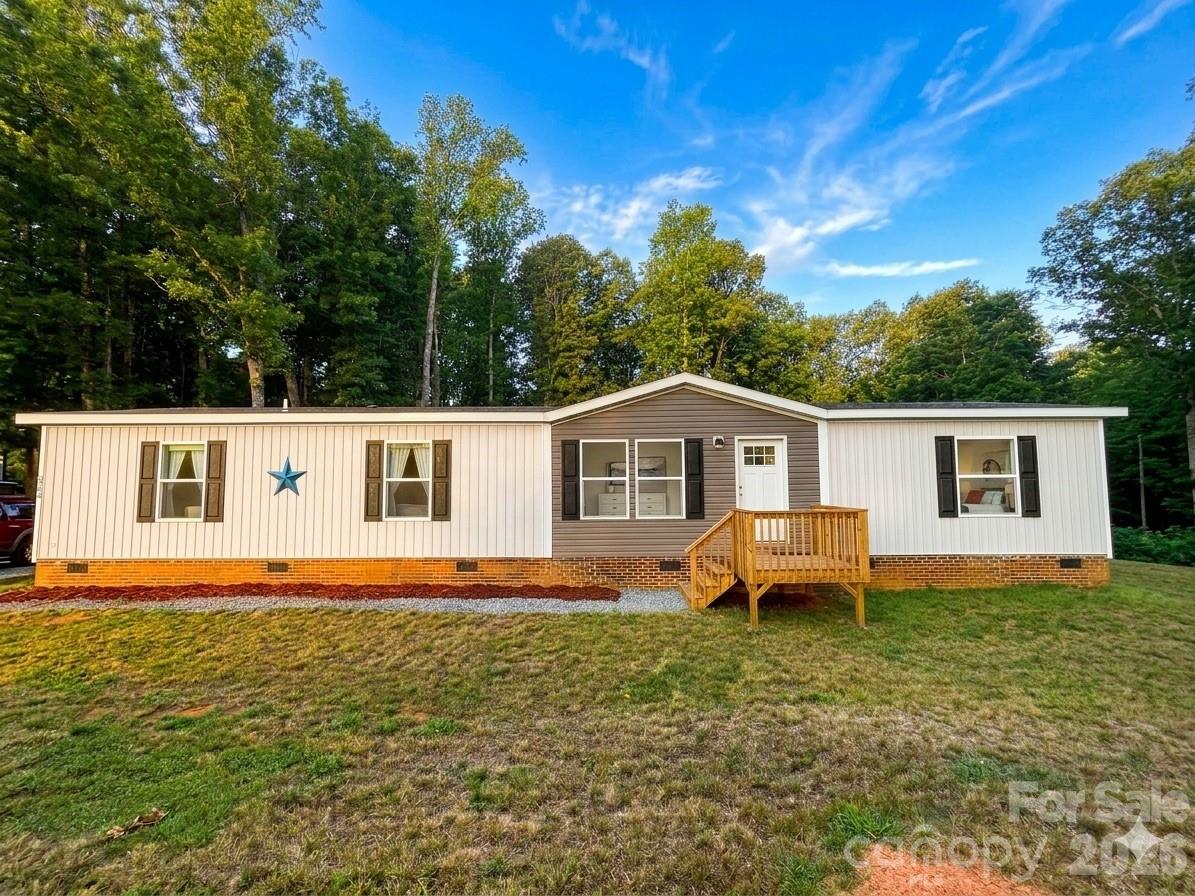 Welcome to 5351 Walter Lowman Rd, a 2023-built 4 bedroom, 2 bathroom home situated on 1.86 private acres in Connelly Springs. With everything still feeling fresh and new, this home offers an easy, move-in ready opportunity with modern finishes, an open main living area, spacious kitchen with large island, generous bedrooms, and updated bathrooms. Enjoy the privacy of a large wooded lot with room to spread out, garden, entertain, or simply enjoy a quieter setting. The location offers a peaceful feel while still being convenient to everyday needs, with local dining, grocery options, and shopping nearby, plus easy access to Morganton, Valdese, Hickory, and outdoor recreation throughout Burke County. Outdoor lovers will appreciate being near South Mountains State Park, known for hiking, biking, horseback riding, fishing, picnicking, and scenic trails, including High Shoals Falls. A newer home, acreage, privacy, and convenience... this one checks all the boxes!