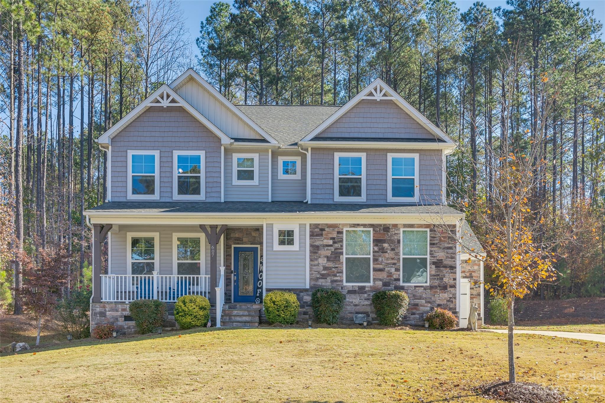 Welcome home to this meticulously maintained, gorgeous home located in the heart of Lake Wylie! Sitting on over an acre, enjoy those beautiful Carolina sunsets or morning coffee from a rocking chair front porch, or screened-in back porch in private back yard. As you enter this home you will find an office with French doors, open concept living room with a chef’s dream kitchen- large granite countertops, double oven, gas range and Kenmore SS appliances. Also, a large mud room off the garage with a sink. This immaculate property has bedrooms and full bathrooms on all 3 levels, all spacious with walk in closets. A large laundry room on the upper level with an oversized bonus room, primary bed/bath upgraded with quartz countertops and fixtures. The 3rd level bedroom comes with a movie projector. Smart Home features include thermostats, lighting, garage access and exterior cameras.  The neighborhood has RV/boat storage, pool, and so much more and Award winning Clover Schools!