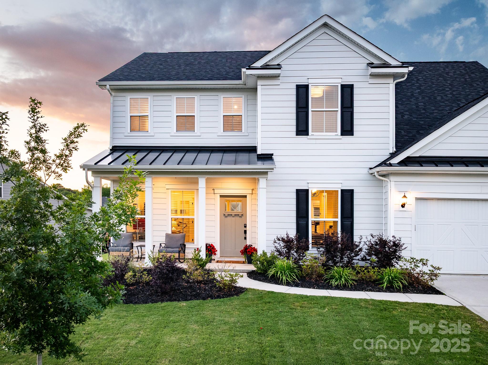 Stunning home in the gated neighborhood of Bretagne, 13 min. from The Bowl at Ballantyne, 15 min. from new Indian Land Costco & Lowe’s Foods shopping center & 30 min. from Uptown Charlotte. Beautifully designed & filled w/natural light, featuring a main floor office w/french doors, bright sunroom overlooking backyard, built-in drop zone area off the garage & a private bedroom w/ full bath, perfect for guests.  Kitchen features walk-in pantry, large island, gas cooking & stainless steel appliances. Open-concept kitchen & family room are ideal for entertaining, highlighted by custom built-in cabinetry surrounding the fireplace.   Upper-level includes loft w/large windows, a spacious primary suite w/luxurious soaking tub & his-and-hers walk-in closets & 3 add'l bedrooms, one w/private bathroom. Rear yard backs to common area space. Paver patio spans the full width of the rear of the home—perfect for relaxing or hosting gatherings. Neighborhood includes outdoor pool, cabana & play area.