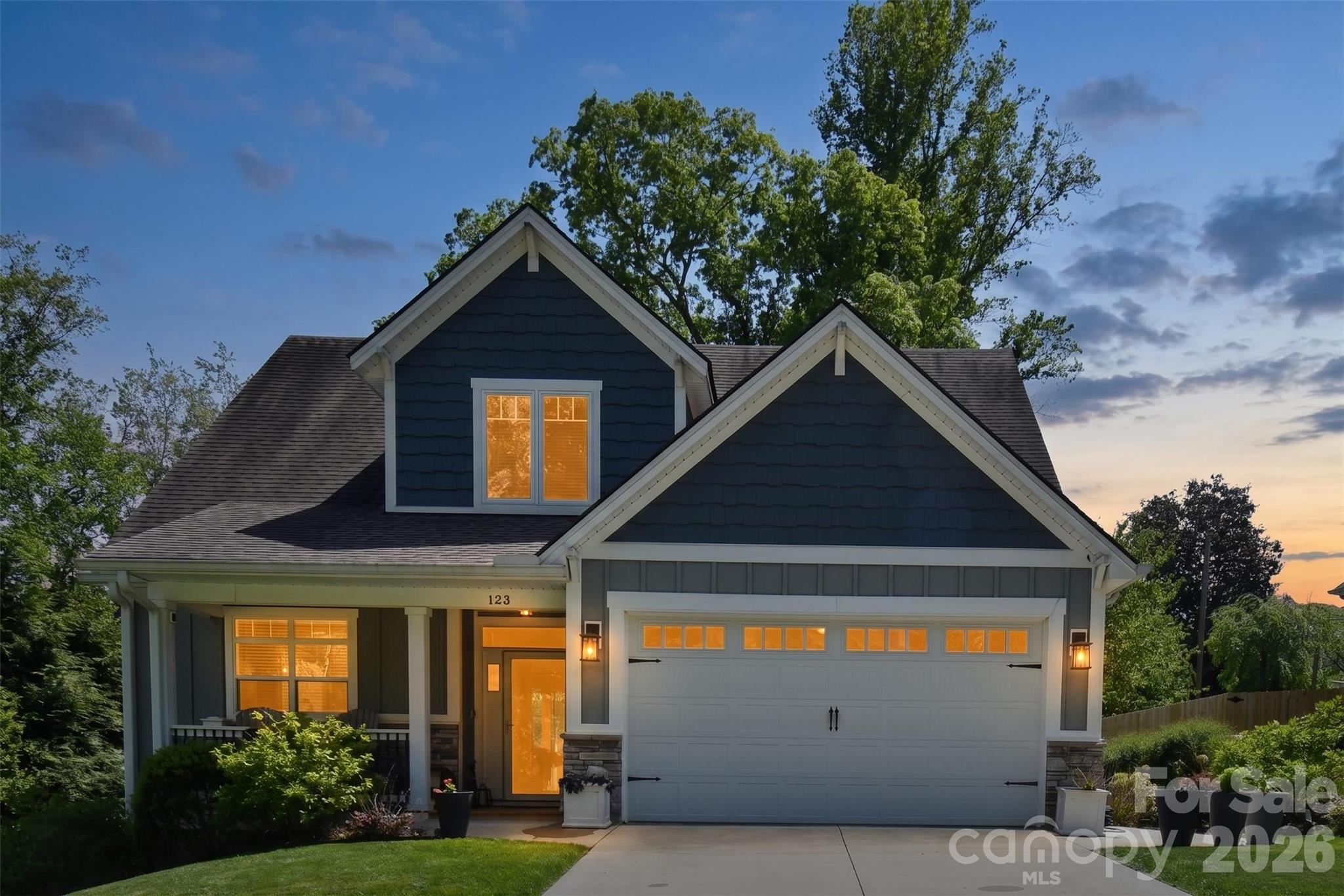 Great new price on this meticulously maintained 2016 home in Arden, where pride of ownership shines through every detail. This single-owner gem has been cherished and cared for since day one, offering the perfect blend of modern luxury and timeless comfort.
Step inside to discover gleaming wide-plank hardwood floors that flow throughout the open-concept living spaces, reflecting the abundant natural light from tall windows and soaring cathedral ceilings. The heart of the home is the beautiful kitchen, featuring elegant granite countertops, stainless steel appliances, and high-end finishes that make every meal a delight.
The thoughtful layout includes a spacious primary suite on the main level for easy living, with four generous guest bedrooms upstairs—ideal for family, visitors, or a home office setup. High-quality touches abound: spray foam insulation for exceptional energy efficiency and comfort, rock and granite accents, and a home that's generator-ready (generator does not convey).
Outside, prepare to be wowed by the landscaping that's truly to die for—a thick, lush lawn and mature plantings create a private oasis you'll love spending time in. The street itself offers that wonderful older-neighborhood charm, with its established feel and sense of community, while this newer cluster of well-built homes brings fresh, contemporary living into the mix. It's the best of both worlds in a welcoming, established setting.
Located in Arden, you're perfectly positioned to enjoy the vibrant energy of Asheville—with its acclaimed dining, arts scene, and attractions—just minutes away, all without the higher Asheville city taxes. Easy access to Biltmore Park Town Square, Lake Julian, the airport, and major highways makes everyday living a breeze while keeping you close to the action.
This is more than a house—it's a sweet, welcoming home ready for its next chapter of cherished memories. Don't miss the opportunity to make it yours!