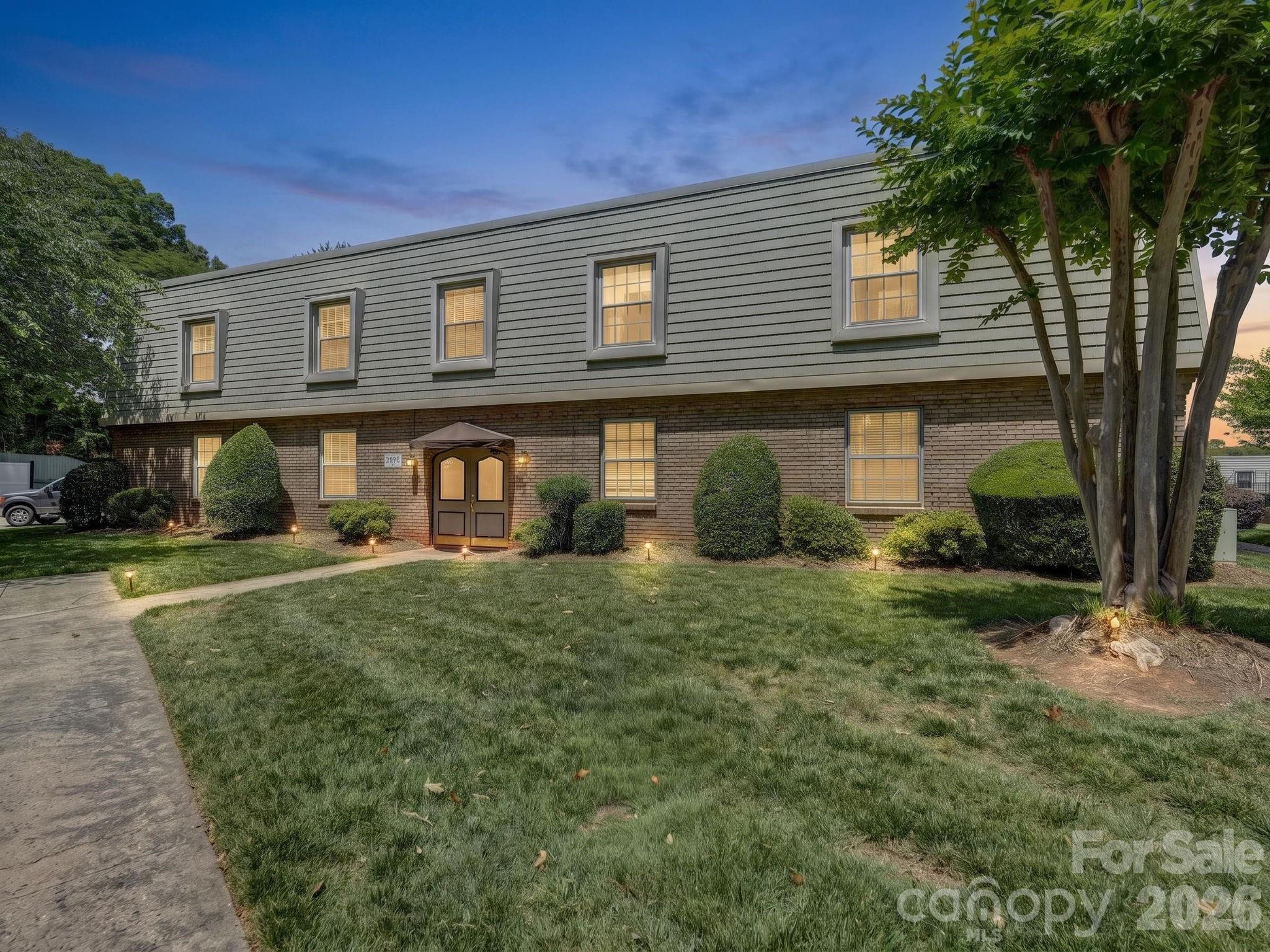 A true location win in this updated top-floor condo at popular Dilworth Edge. This address puts you in the middle of it all, close to South End, Dilworth and Park Road Shopping Center. This unit is tucked in the back of the complex, with a spacious covered back porch overlooking a lovely courtyard. Inside is nicely updated with new lighting, designer wallpaper and a stylish accent wall in the dining room. The kitchen has shaker cabinetry, new hardware, a wine rack/pantry, & granite countertops. There are two bedrooms, both with new carpet and one with a walk-in closet. Both bathrooms have updated vanities, and decorative shelving. And a big win for the new owner, NEW HVAC in 2026! Just in time for summer, relax at the community pool. This one checks the boxes, and gets you into a premier spot at a great price. Welcome home!
