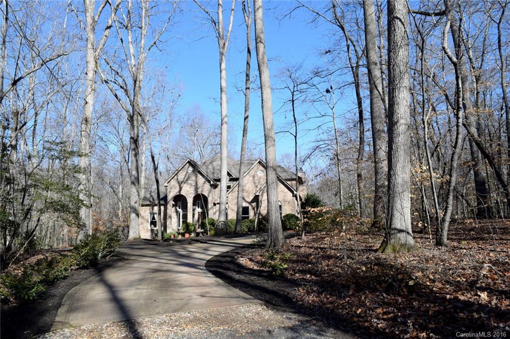 Great Updates! No compromises! This home is a contemporary style w/over 4000 square feet, 20+ acres, 48X60 barn, impeccably landscaped grounds, ponds & creeks, wooded areas, absolute privacy & a once in a life time opportunity. Barn has 6 stalls, tack room & wash bay. There are two open areas 12x48. Soaring ceilings, wood floors, arched openings, 4 bd 3 ½ bath. 2 living rooms, dining & bonus room. All new duct work & updated master suite! Very private, but convenient. Awe-inspiring backyard!