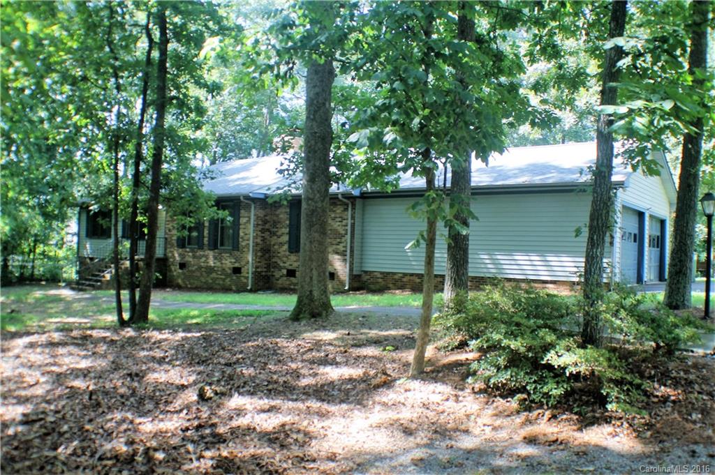 Great location only minutes to shopping and dining in Ballantyne, Fort Mill & Indian Land - Spacious all brick Ranch home in desirable BLACK HORSE RUN. Home features 3 bedrooms and 2 full baths, formal living room, formal dining room, a spacious eat-in kitchen with tons of cabinet space. Large family room with a beautiful brick, wood burning fireplace! This home sits on 1 acre of land with a private backyard, gazebo, work shop or detached garage. "Home Sold As Is - Chimney Sold As Is"