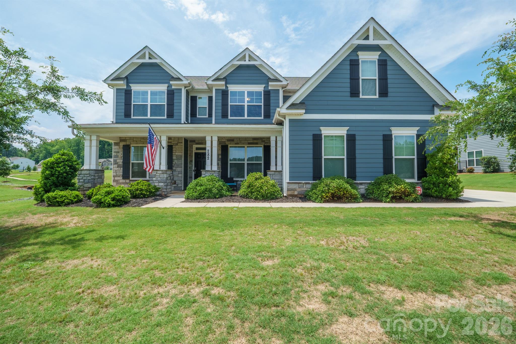 Welcome to the Charleston floor plan in the highly sought-after Wrenn Creek community of Waxhaw. Situated on a nearly half-acre fenced lot, this home offers over 3,800 square feet of thoughtfully designed living space with 5 bedrooms, 4 full baths, a bonus room, private office, and exceptional indoor-outdoor living.

A charming covered front porch welcomes you inside, where LVP flooring, abundant natural light, and custom design details create an inviting atmosphere. The main level features a private office with French doors, an elegant dining room with wainscoting and tray ceiling, a guest suite with a full bath, a sunroom, and a spacious great room anchored by a gas fireplace with marble surround.

The gourmet kitchen is designed to impress with white cabinetry, quartz countertops, an oversized island, farmhouse sink, gas cooktop, double wall ovens, soft-close cabinetry, and a large walk-in pantry. A convenient butler’s pantry provides additional storage and serving space.

Upstairs, the primary suite offers a true retreat with space for a sitting area, a spa-inspired bath featuring dual vanities, ceramic tile, soaking tub, and separate shower. An oversized walk-in closet completes the space in the suite. Three additional bedrooms, including one with a private bath and two connected by an oversized Jack-and-Jill bath, provide ample space for family and guests. A large bonus room offers flexible living space for a media room, playroom, or hobby area, while the laundry room is conveniently located on the second floor.

Outdoor living shines with a sunroom overlooking a paver patio, built-in fire pit with seating area, and an oversized fenced in backyard. Exterior features include fiber cement and stone accents, energy-efficient insulated windows and doors, and a 3-car garage.

Residents of Wrenn Creek enjoy exceptional amenities including a community pool, cabana, playground, sidewalks, and walking trails. Ideally located just minutes from Wesley Chapel shopping, dining, and entertainment, and less than 10 minutes from charming downtown Waxhaw.