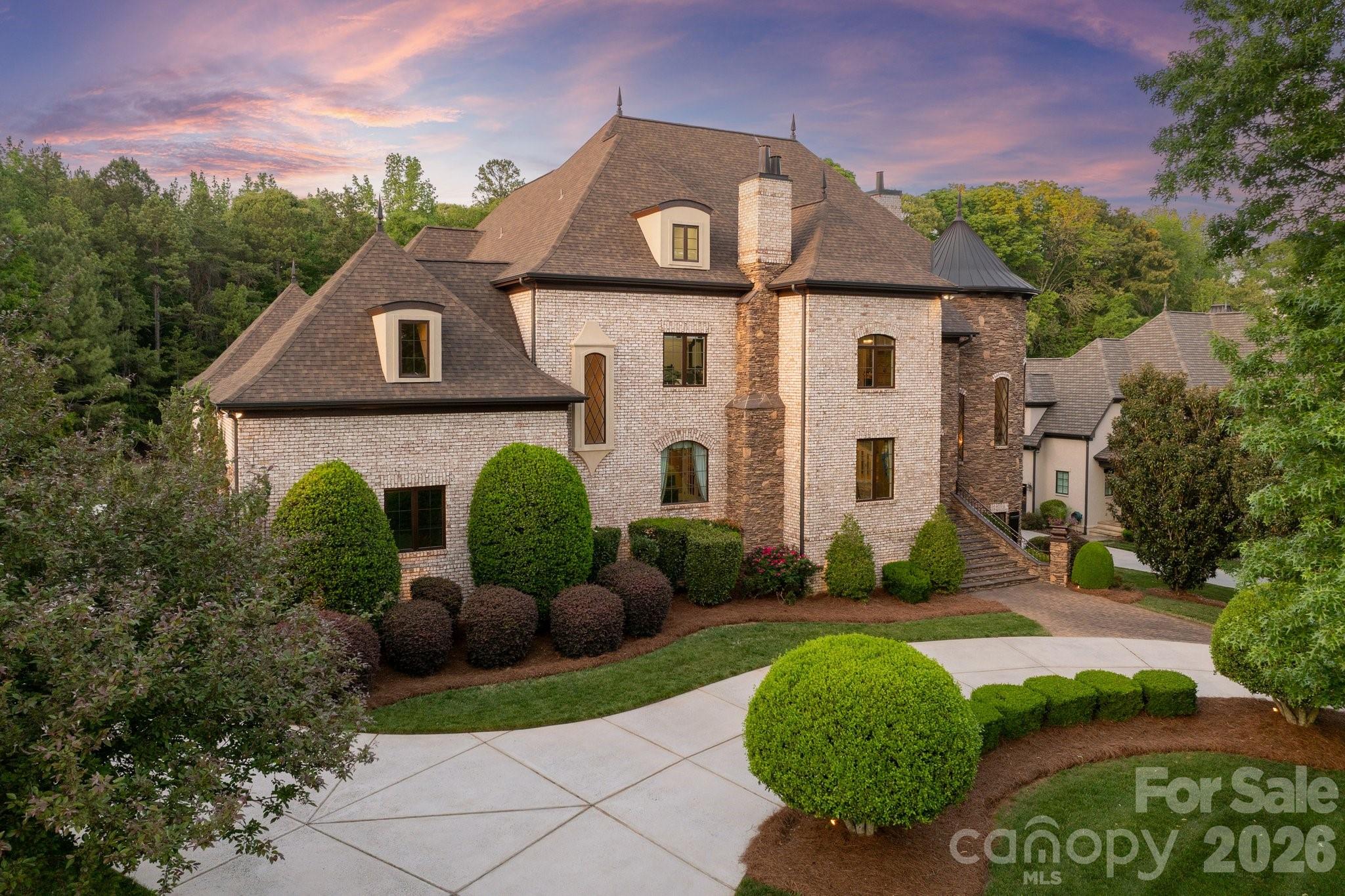 Exquisite custom estate in the prestigious gated community of Skyecroft, offering over 10,000 square feet of thoughtfully designed living space on a private .69-acre homesite. Blending timeless architecture with modern functionality, this freshly painted residence showcases exceptional craftsmanship and refined details at every turn.

Designed for both grand entertaining and everyday living, the heart of the home is a true chef’s kitchen featuring dual oversized islands, an expansive walk-in pantry with prep sink, and a seamless connection to the breakfast area and inviting keeping space anchored by a custom stone fireplace.

The home offers six generously sized ensuite bedrooms, including a beautifully appointed main-level guest suite. The upper-level primary retreat is nothing short of extraordinary, complete with a private sitting area, custom fireplace, and direct access to a serene terrace—creating a true sanctuary.

Multiple flexible living spaces enhance the home’s versatility, including two mezzanine-level bonus rooms ideal for media and fitness, a fully finished basement designed for recreation with a full kitchen and direct access to the outdoor living areas, and a third-floor flex space perfect for an office, playroom, or additional bedroom with full bath. The home is also elevator-ready, offering convenience across all levels if needed in the future.

Step outside to a resort-style backyard oasis, where a heated pool and spa, private cabana with full bath and storage, and expansive green space create the ultimate setting for relaxation and recreation. Covered outdoor terraces on two levels—complete with a fireplace and built-in grilling station with bar seating—provide an exceptional backdrop for year-round entertaining.

Additional highlights include a rare four-car garage, circular driveway, and access to top-rated schools, all within one of the area’s most sought-after gated communities.

A truly one-of-a-kind residence where luxury, scale, and thoughtful design come together seamlessly.
