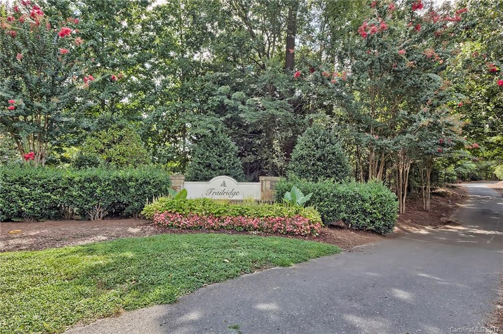 In desirable Tega Cay, this home is steps away from the walking trails and minutes away from vrs parks and nearby attractions.  Popular floorplan with Master down.  The upgrades include granite countertops/tile backsplash/new range/new microwave in the kitchen, new carpet, custom shelving in Master closet, Built in shelves in Garage, shutters, blinds, new hot water heater 2016 and more.  2 walk in attic spaces upstairs. Well maintained and move in ready!