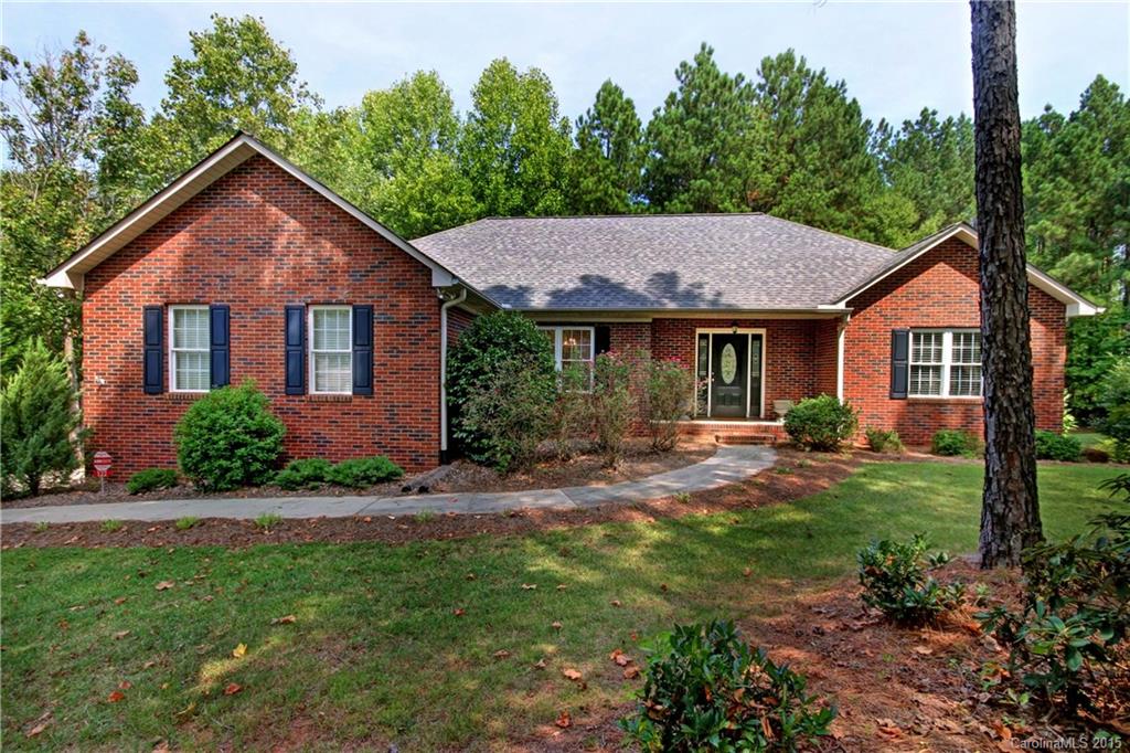 Beautiful home on large wooded corner lot in highly desirable Wildlife Bay Subdivision. Hardwood floors, solid surface countertops, walk in closets in all bedrooms. Basement offers a large playroom, full bath & workshop. Neighborhood has a walking trail that leads to the lakeside.