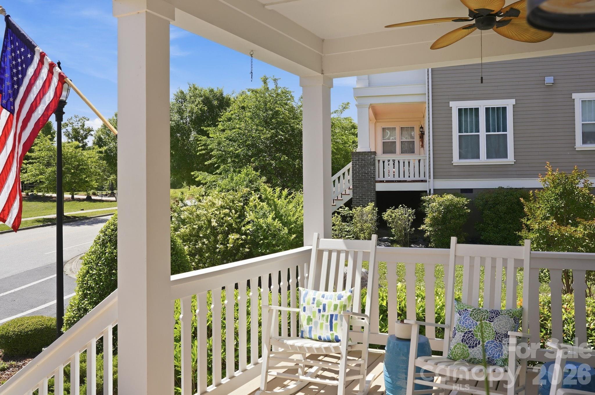 FRESH PRICE. SAME STANDOUT HOME. Experience the ultimate RIVERWALK lifestyle in this METICULOUSLY MAINTAINED, craftsman-style Evans Coghill charming home! Nestled on a prime CORNER LOT directly across from serene open green-space and less than 1/2 mile to river access, this MOVE-IN READY gem blends southern charm with sophisticated modern updates. From the moment you arrive, the timeless architecture and beautifully-manicured landscaping impress with inviting curb appeal. Boasting 4 bedrooms and 2.5 bathrooms across 2684 square feet, every inch of this home has been thoughtfully designed for modern living. Soaring 9' ceilings and heavy crown moldings throughout home. The stunning Kitchen is a true chef’s delight featuring upgraded 42" white cabinets with glass, stainless steel appliances, gas range, granite countertops, an expansive central island, tiled backsplash, and a walk-in pantry. The heart of the home flows from the kitchen through the dining area into the  living space with cozy gas fireplace - all ideally made for everyday moments and easy entertaining. Enjoy views to the FENCED BACKYARD from the generous-sized living room. Your private sanctuary awaits on the spacious MAIN-LEVEL PRIMARY SUITE with tray ceiling, dual vanities, a large walk-in shower, and walk-in closet. A beautiful, custom-made drop zone adds beauty and function as you enter the primary oasis. Flexible Living includes a dedicated home office on main level and a versatile second-level loft perfect for a media center or playroom. Three bedrooms and full bath complete the second-level. Loaded with RECENT UPGRADES including exterior & interior paint, refinished (light-colored stain) site-laid hardwood floors, hardwood finished staircase, newer carpet on second-level, irrigation in front and back of home, fenced back yard, drywall & epoxy floor in garage and plantation shutters throughout home. Step outside to your private retreat. The covered back porch is perfect for morning coffee or evening entertaining, overlooking the perfectly-manicured backyard. Additional paver patio space with exterior outlet wired for outdoor TV. The detached 2-car garage encloses the space for a true courtyard setting. Unmatched Riverwalk amenities include a community pool with lazy river, clubhouse, playground, sidewalks, scenic walking trails, canoe & kayak launch points, BMX Supercross Track, velodrome, criterium course, local dining, wine bar, shops, and convenient canoe/kayak access. This golf cart-friendly neighborhood offers quick access to I-77 (via the new Palmetto Parkway), Rock Hill, Fort Mill, and Charlotte—making it perfect for commuters and those seeking an active lifestyle. Experience the best of Riverwalk living in this home that shows like a model!