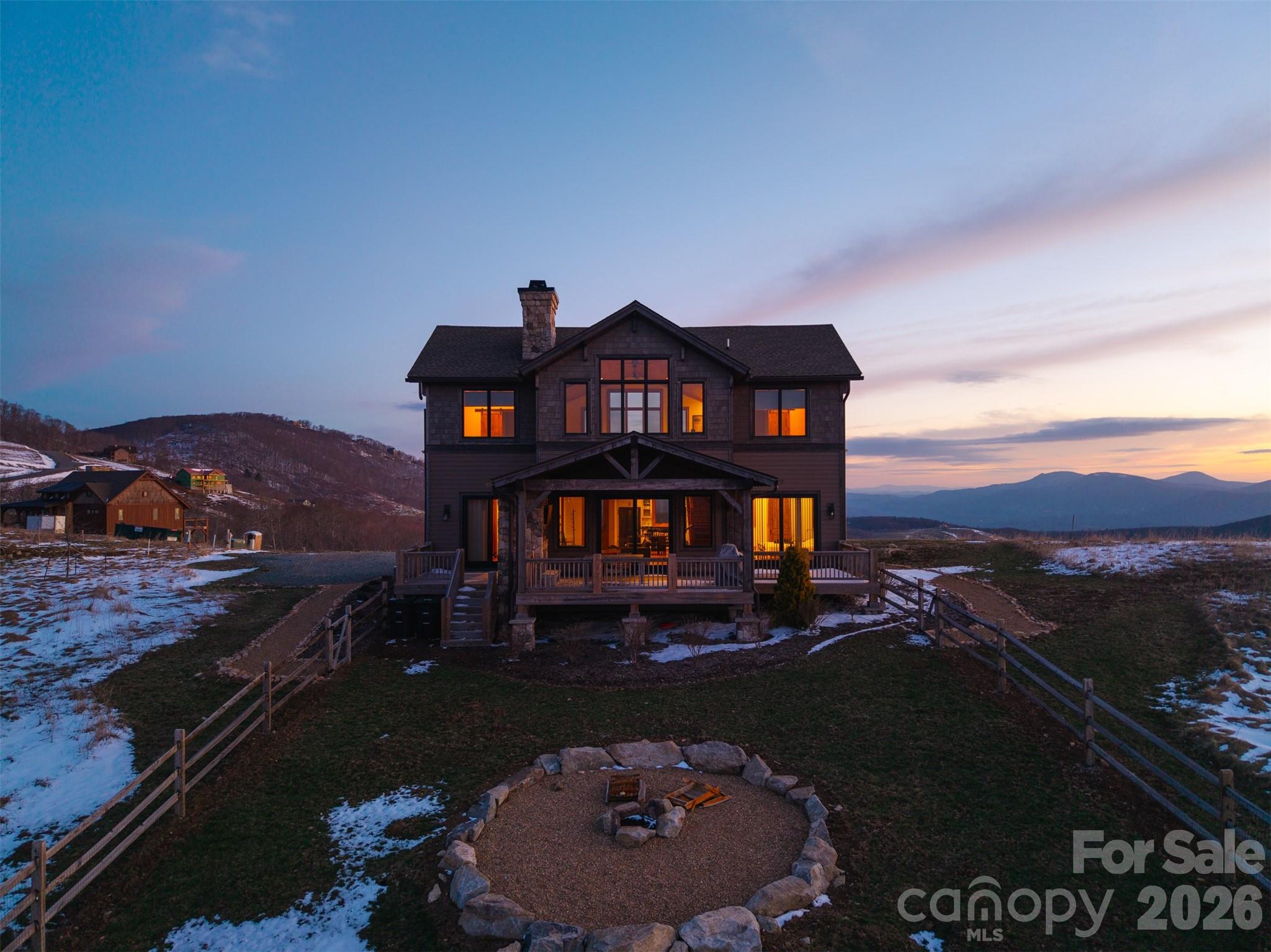 Eagles Peak | Luxury Banner Elk Mountain Retreat with Panoramic Blue Ridge Views

Perched in the gated Monteagle community, 352 Great Sky Drive delivers long-range Blue Ridge Mountain views, turnkey luxury, and exceptional short-term rental potential—just minutes from downtown Banner Elk, Beech Mountain, and Sugar Mountain.

Built by Tom Eggers, this custom home features an open-concept layout designed around the views, with vaulted wood-beamed ceilings, a floor-to-ceiling stone fireplace, and expansive windows showcasing layered mountain ridgelines.

The chef’s kitchen offers leathered granite countertops, premium appliances, custom cabinetry, and a large island ideal for entertaining.

The main-level primary suite includes private deck access and a spa-style bath, while a second guest suite on the main level also opens to the deck—perfect for enjoying sunrise views.

Outdoor living is a standout with a covered deck, stone fireplace, and mounted TV, creating year-round space for relaxing or hosting against a mountain backdrop.

The upper-level loft with wet bar and game area adds flexible entertaining space, while additional guest suites provide privacy for family and guests.

Located in one of Banner Elk’s most sought-after gated communities, this home is ideal as a luxury second home, High Country mountain retreat, or income-producing STR investment.

Offered furnished with strong rental appeal. and solid rental history, outstanding views, and immediate usability—this is a rare opportunity in the Banner Elk market.