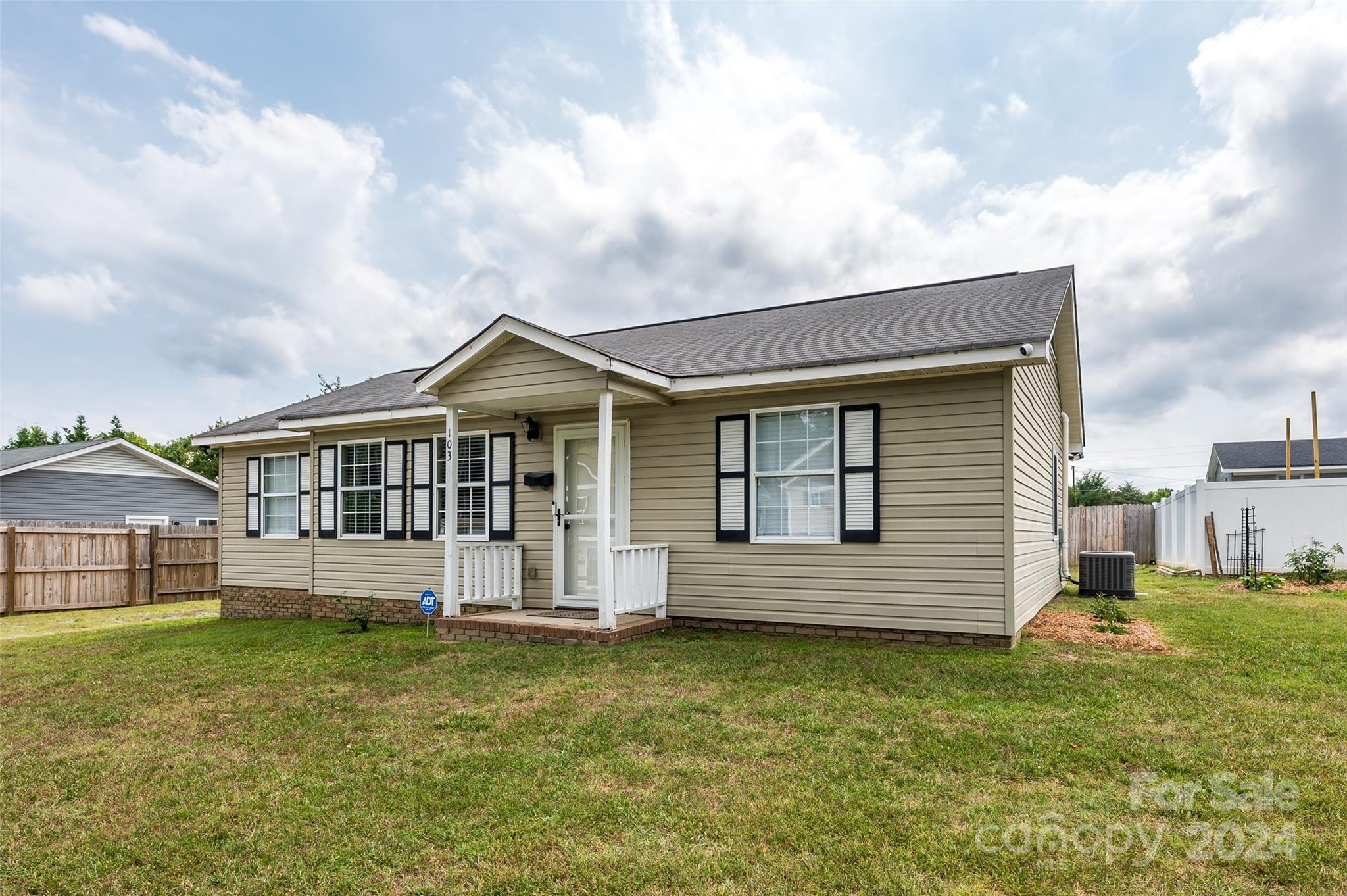 Great home in Clover is ready for its new owner! This ranch home has laminate floors that flow through the large living room down the hall and into the bedrooms. The eat in kitchen has tile floors, stainless steel appliances that are only 2 years old, ample cabinet and counter space, access to the laundry room with shelves and cabinets, as well as the door leading to the back yard. The split floor plan features the primary suite with private half bathroom on one side of the house and the other spacious secondary bedrooms are located on the other side. The newly renovated full bathroom has tile floor, walk in shower, new toilet and new exhaust fan with a Bluetooth speaker. Relax or entertain in the oversized yard. Large building for all your storage needs is located in the side yard. All the insulation in the attic was also just upgraded as well as some of the wiring in the house. Home also has 2 driveways for your convenience.