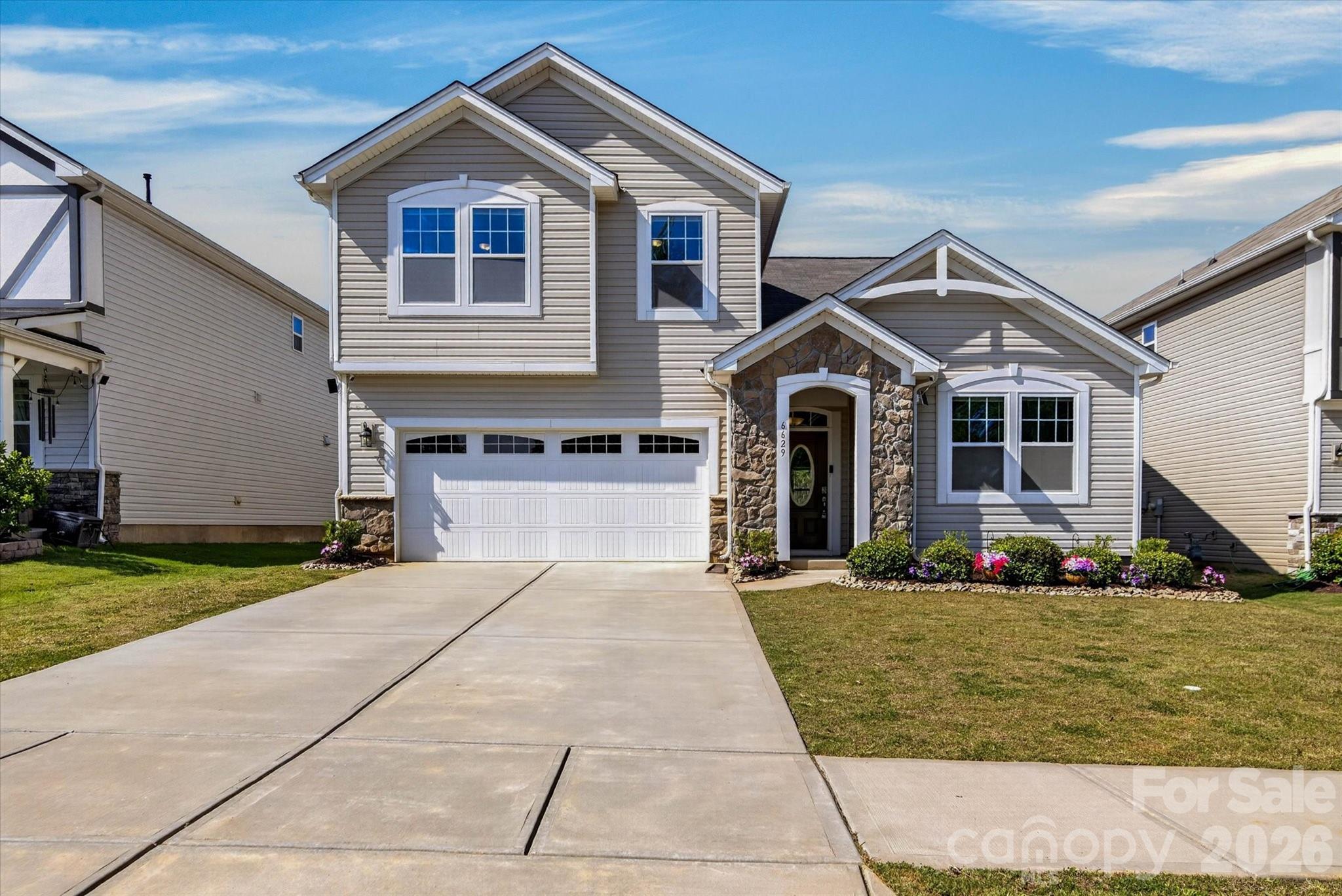 Welcome to this beautifully maintained, better-than-new Amelia floorplan in the desirable Cheyney community! Built in 2021, this move-in-ready home offers approximately 2,600 heated square feet with 4 bedrooms, 2.5 bathrooms, a spacious loft, flex room/home office, main-level owner's suite, main-level laundry room, and a 2-car garage. One of the home's standout features is its rare privacy, with no direct front or rear neighbors, creating a more open feel and peaceful setting than many homes in the area. Enjoy views of green space from the front and added privacy in the backyard, offering endless possibilities for outdoor living and entertaining.
The open-concept layout is ideal for everyday living, featuring generous living spaces, a functional design, and abundant natural light throughout. Seller will consider contributing up to $5,000 toward buyer closing costs with an acceptable full-price offer.
Conveniently located near Uptown Charlotte, Huntersville, I-485, I-77, shopping, dining, and entertainment. Community amenities include pools, a clubhouse, playground, sidewalks, and streetlights. Priced competitively and available for immediate move-in.