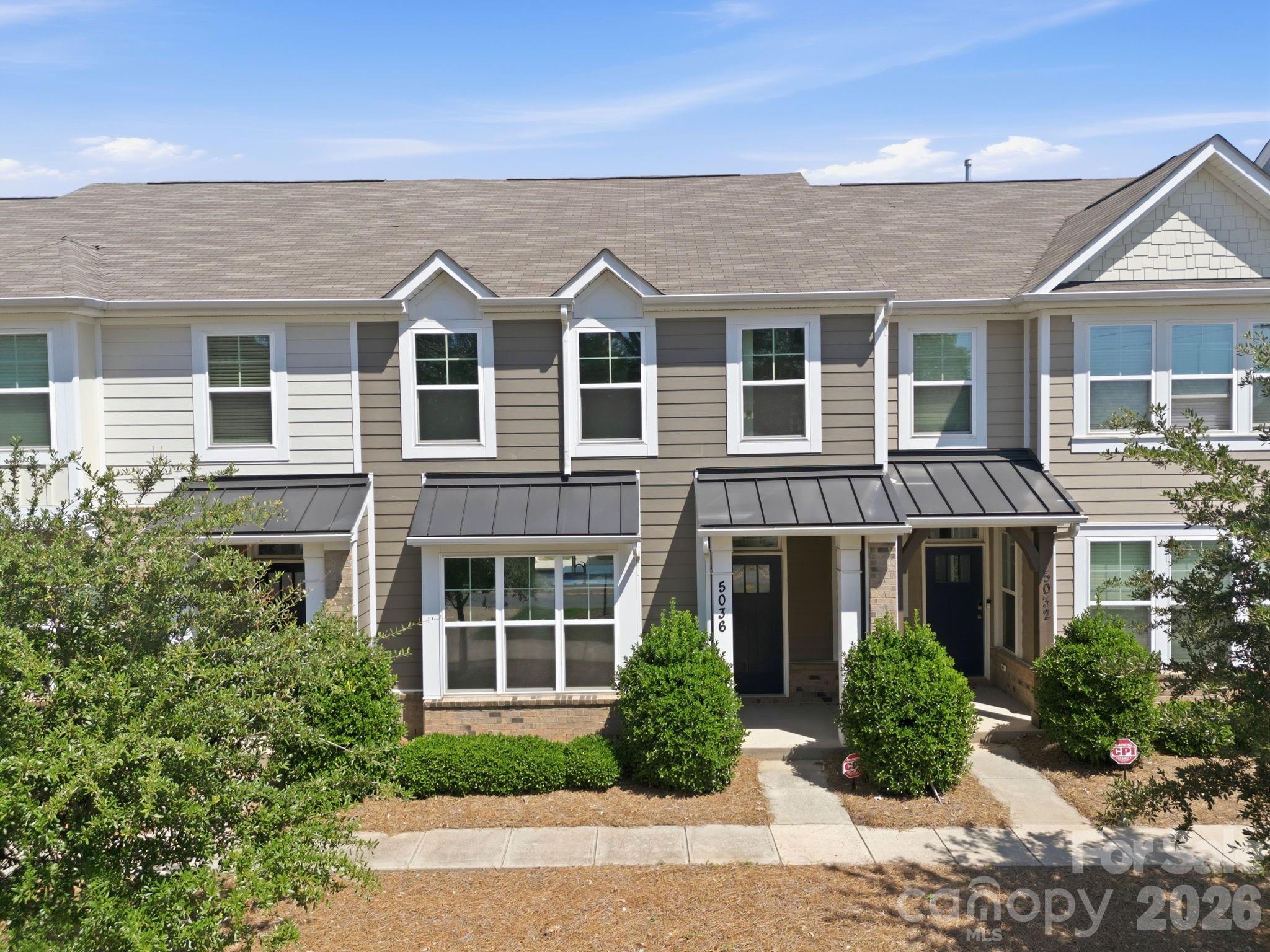 Move-in ready Charlotte townhome with fresh paint, new upstairs carpet, and upgraded plank flooring on the main level. Open-concept floor plan features oversized kitchen island, granite countertops, stainless steel appliances, walk-in pantry, and pocket office/home office space. Convenient drop zone by garage. Enjoy low-maintenance living with quick access to i-77, i-485, and I-85, plus shopping and dining near The Shoppes at Davis Lake.