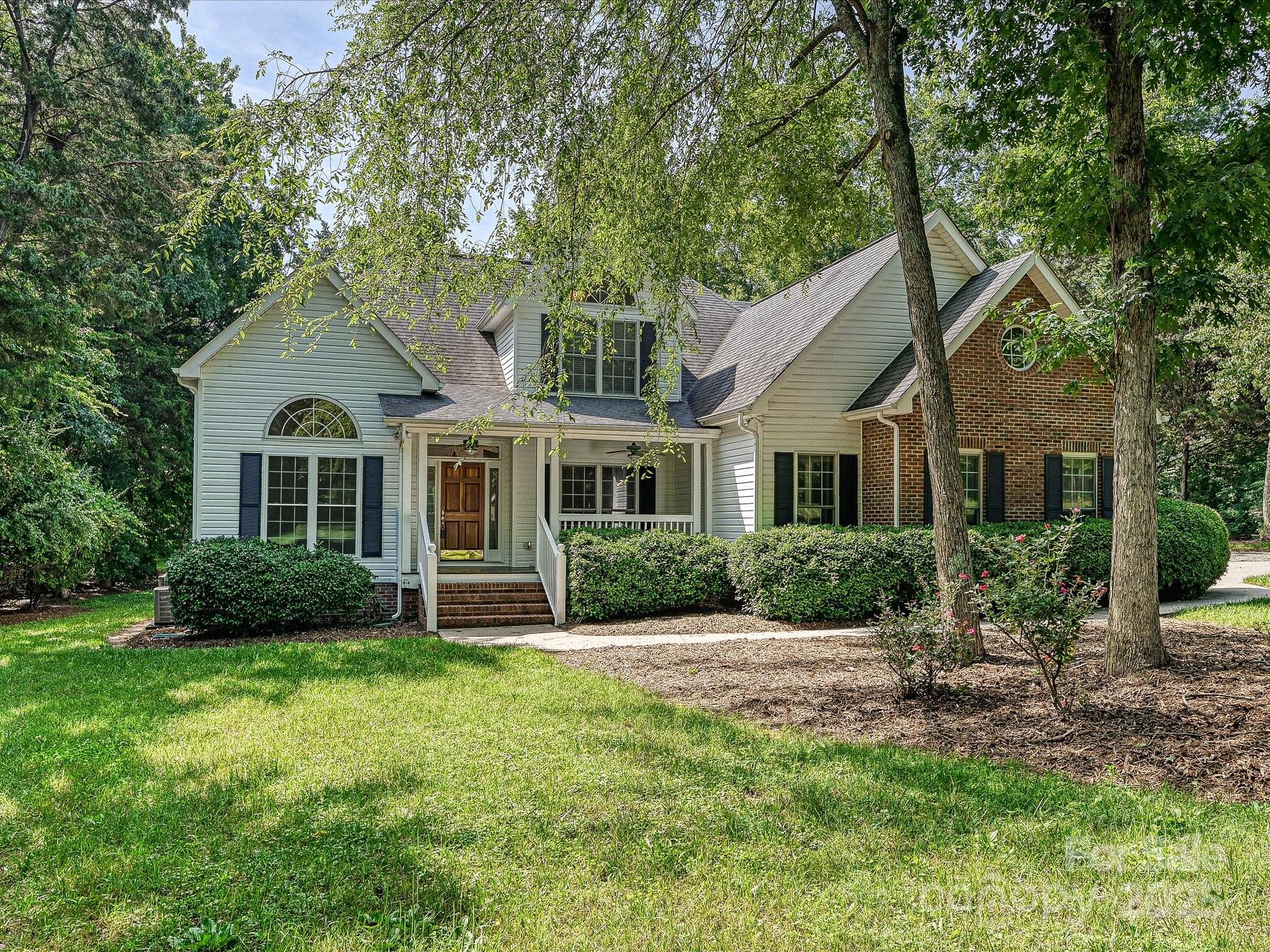 Don’t miss this rare opportunity to own a home in the desirable Hamilton Place neighborhood! Located on the SC side of the community within the popular Fort Mill School District! Partial brick home; oversized side load garage with built in storage; owners suite and a study or additional bedroom and full bath on the main level; two bedrooms and a huge bonus room/bedroom upstairs; beautiful updated kitchen with granite countertops, island with quartzite top, double wall oven, gas cooktop, lots of drawers, high end cabinets, and ceiling beams; gorgeous updated owners bath with “air-jetted“ soaking tub; two story great room; numerous vaulted ceilings; pocket doors; sliding doors leading to huge rear deck; incredible storage barn with three 10x16 sections; private rear yard; mature trees and beautifully landscaped 1 acre lot.
