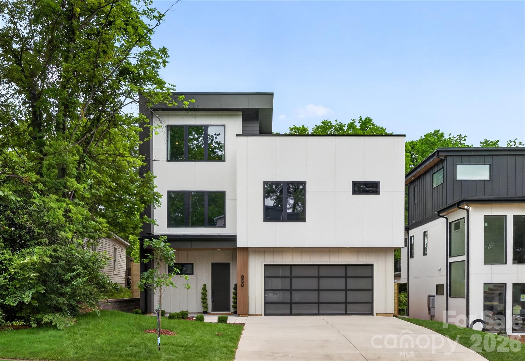 Experience a home designed to support everyday wellness, comfort, and connection. Thoughtfully built with energy-efficient features including ZIP System sheathing, a spray-foam insulated roof deck, high-performance low-E windows, zoned heat-pump HVAC, smart thermostats, and a tankless water heater with recirculation for year-round efficiency and comfort. Enhanced sound insulation in bedrooms, bathrooms, laundry areas, and between floors creates a peaceful retreat from the outside world. Natural light is complemented by soaring 10-foot ceilings, European white-oak hardwoods, designer lighting, and premium finishes throughout. Every bedroom features a private en-suite bath, while custom closets, a mudroom, and dedicated scullery bring effortless organization. Enjoy seamless indoor-outdoor living with a covered rear patio, natural-gas fireplace, EV-charger readiness, and smart-home wiring for audio, security, and connectivity. Ideally positioned with direct Greenway access and just minutes from the dining, entertainment, and retail destinations of Optimist Hall and Plaza Midwood, this home offers a balanced lifestyle where wellness, convenience, and vibrant city living come together.