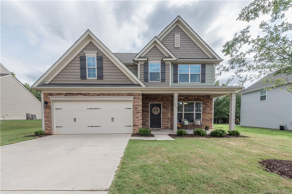 Don't miss this lovely 4 br/3ba home + loft with tree-lined backyard! Enjoy the open floor plan with pretty vinyl plank floors, formal dining, and inviting family room with gas fireplace. Light & bright throughout with bedroom and full bath on main. Large kitchen includes premier cabinets, tile backsplash, granite countertops, and SS appliances. Spacious loft up + 3 more bedrooms including master w/trey ceiling and 5 piece bath. Great  backyard offers privacy and room to play. Community pool!
