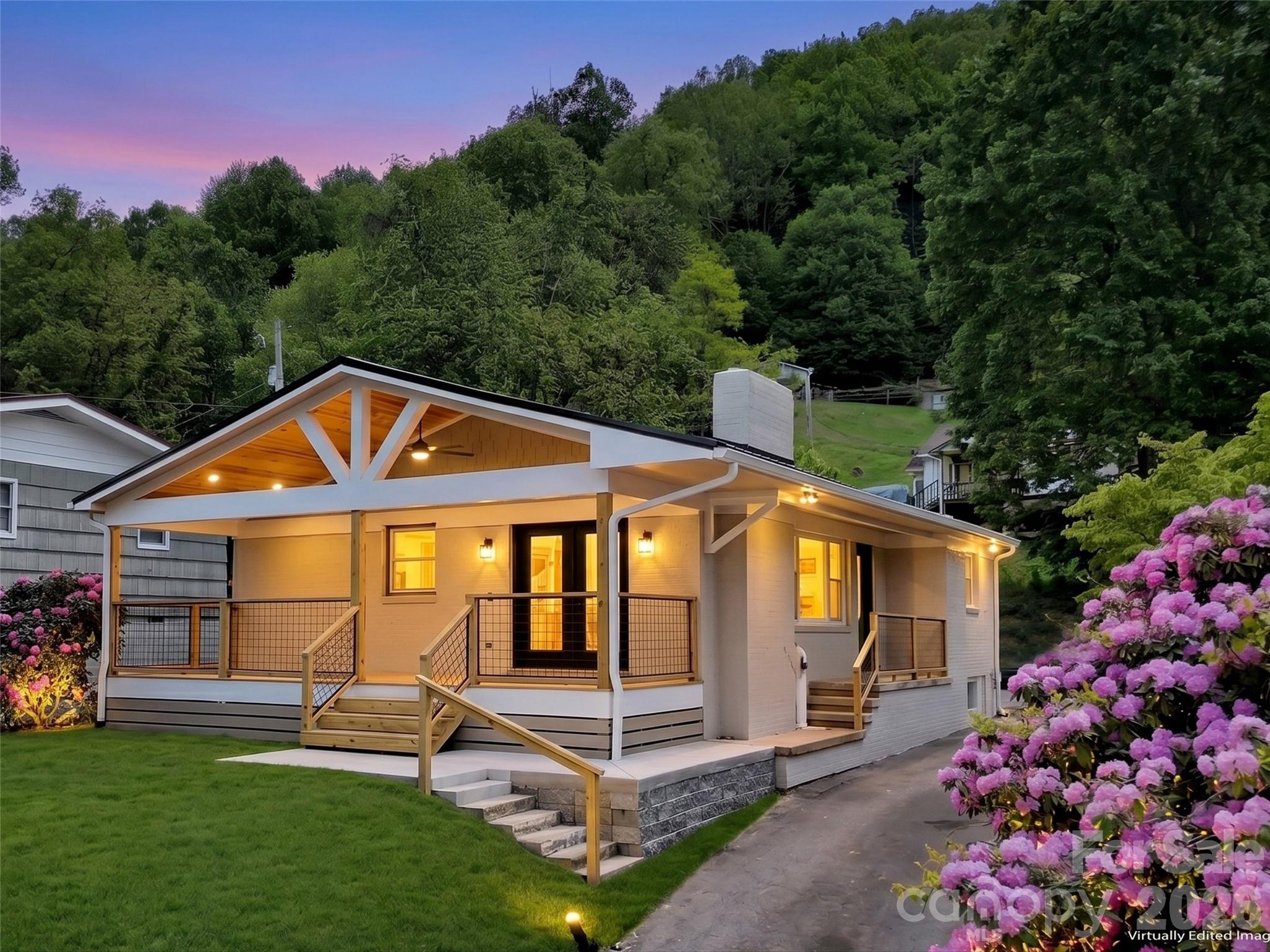 All the hard work has been done and the worries taken away. Conveniently located to Waynesville, Cherokee and interstate I-40 this home has been beautifully updated and is ready for you to move in and enjoy. Every inch of this 2 bedroom 1 bath property has been thoughtfully remolded to offer modern day aesthetic while preserving its classic appeal. The heart of the home is the brand new kitchen. It features premium granite countertops, painted wood cabinets and a full suite of Samsung stainless steel appliances. Showcased in the open main living area are the gorgeous, professionally refinished, original hardwood floors that span into both bedrooms. You'll also find the fireplace with gas logs to be the perfect spot to cozy up to. Not only do the elegant french doors flood the living room with natural light, they lead you to the large covered front porch which has a wooden tongue and groove ceiling, recessed lighting and a large ceiling fan to keep the cool breeze going. The updated bathroom has durable tile floors and a stunning tile surround in the shower. It also includes a convenient built in linen closet for extra storage. All new windows throughout  the home help ensure better energy efficiency for the new Goodman heat pump. Downstairs, you will find a clean full basement that offers and abundance of storage. If you're a first time buyer, looking for a high end rental, or anything in between, you'll want to check this property out.