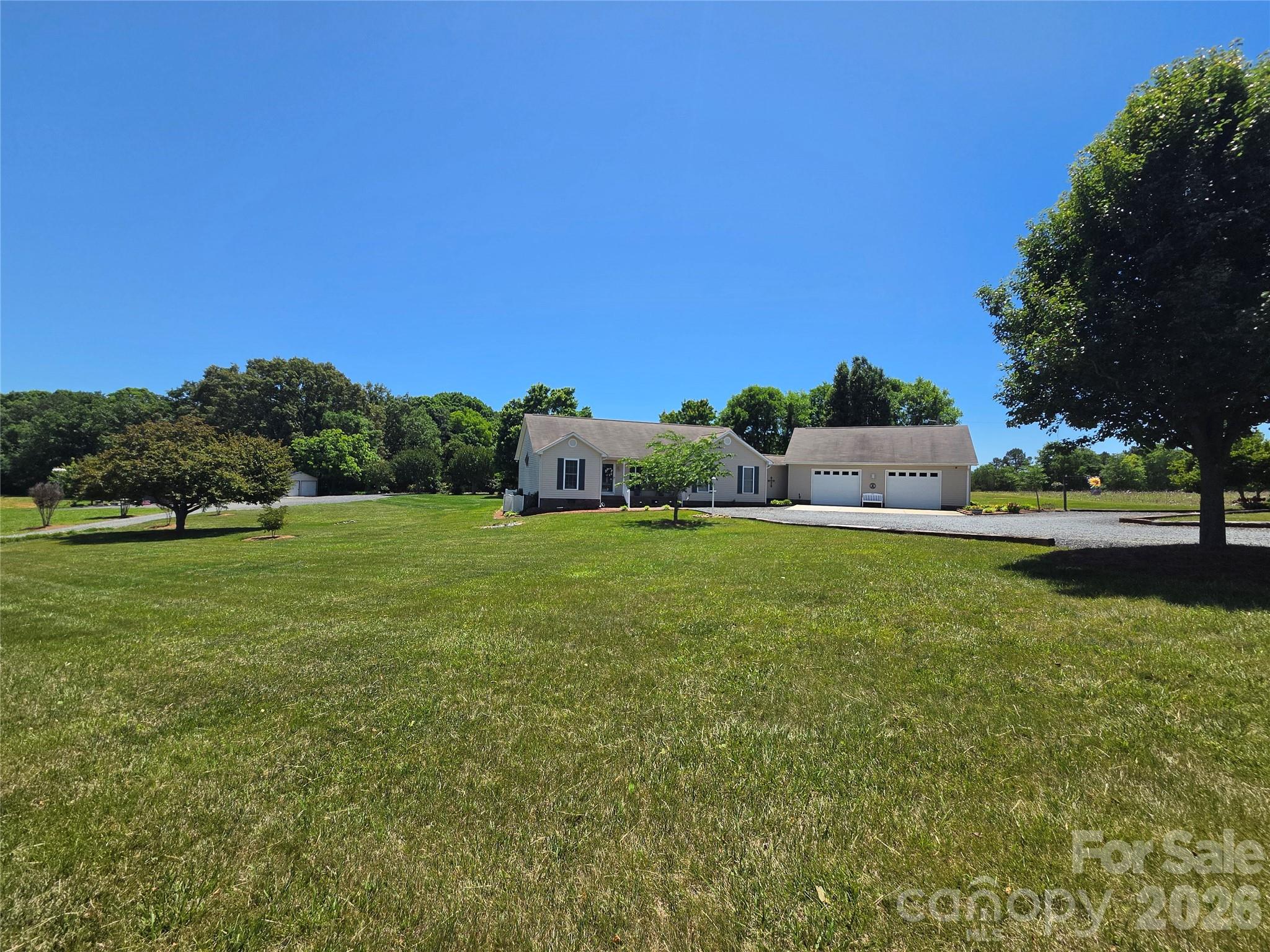 If you're the outdoor enthusiast, look no further! This one owner custom built home and property offers most anything you would want along with several outdoor living areas, all adorned with mature landscaping.  Whether it's the front porch, back covered patio, open patio or firepit area, there's room to host a large number of people.  The oversized attached garage has space for extra refrigerators, freezers and more, along with ample upstairs storage.  Close by the garage is a 2 car carport which now serves as a potting shed then down by the private, stocked pond there is an RV carport and a 20x20 detached metal garage, ideal for a workshop or equipment storage.  The private pond is adorned with a lighted fountain, pier/dock and a working windmill with it's own well that helps fill the pond. With all this, there's still room for a large garden, rec area, a larger workshop/garage or 2nd living quarters. Your options are limitless!