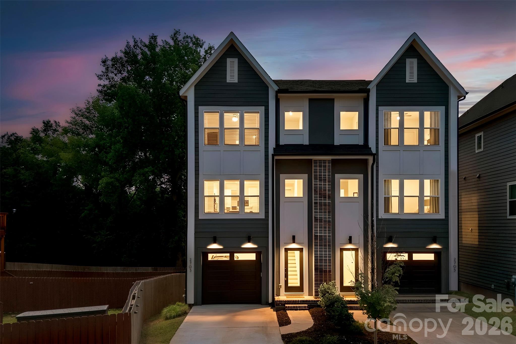 Built in 2023 with NO HOA, this luxurious modern townhouse on a quiet Enderly Park street delivers a refined blend of style, function, and convenience. The three-level layout offers 3 bedrooms, 3 full bathrooms, and 1 half bathroom, ideal for both everyday living and elevated entertaining.

The lower level features a welcoming foyer and a private bedroom with an ensuite full bathroom, creating a gracious guest retreat, home office, or fitness studio with its own sense of privacy. From here, a wooden staircase leads down to the paver stone patio framed by a full privacy wooden fence, transforming the backyard into an intimate outdoor oasis for grilling, al fresco dining, or unwinding under the stars after a long day.

On the second floor, an expansive open-concept kitchen, dining area, and living room are DRENCHED in natural light from the oversized windows of this end unit and grounded by wide-plank floors and 9-foot ceilings for a sophisticated, airy feel. The designer kitchen showcases sleek quartz countertops and subway tile backsplash, an oversized island with seating, custom-style shaker cabinetry, modern pendant lighting, a gas range, and coordinated black and stainless steel appliances, while a wood balcony just off the living room creates seamless indoor–outdoor flow. A stylish half bathroom on this level helps maintain a polished entertaining space for guests.

The third floor is dedicated to the private quarters, where a serene primary suite feels like a personal retreat with its spa-inspired ensuite bathroom featuring an expansive tile shower and dual quartz vanity. An additional bedroom on this level also enjoys its own ensuite full bathroom, and the conveniently located laundry keeps daily routines effortless and organized. A one-car garage provides secure parking or extra storage for sports gear, tools, or seasonal décor.

Enjoy the feel of a quiet neighborhood street while staying moments from Charlotte’s vibrant West End, with easy access to coffee at Enderly Coffee, Not Just Coffee, and Platform Coffee & Kitchen, plus dining at Noble Smoke, LuLu’s, Azul Tacos, Pinky’s Westside, and many other local favorites. Spend weekends at Town Brewing or Lucky Dog Bark and Brew, play tennis or pickleball at Enderly Park, explore Irwin Creek and Stewart Creek Greenway, and appreciate the quick, convenient commute to Uptown Charlotte. This townhome offers luxurious finishes, thoughtfully designed spaces, and an unbeatable location at the heart of Enderly Park!