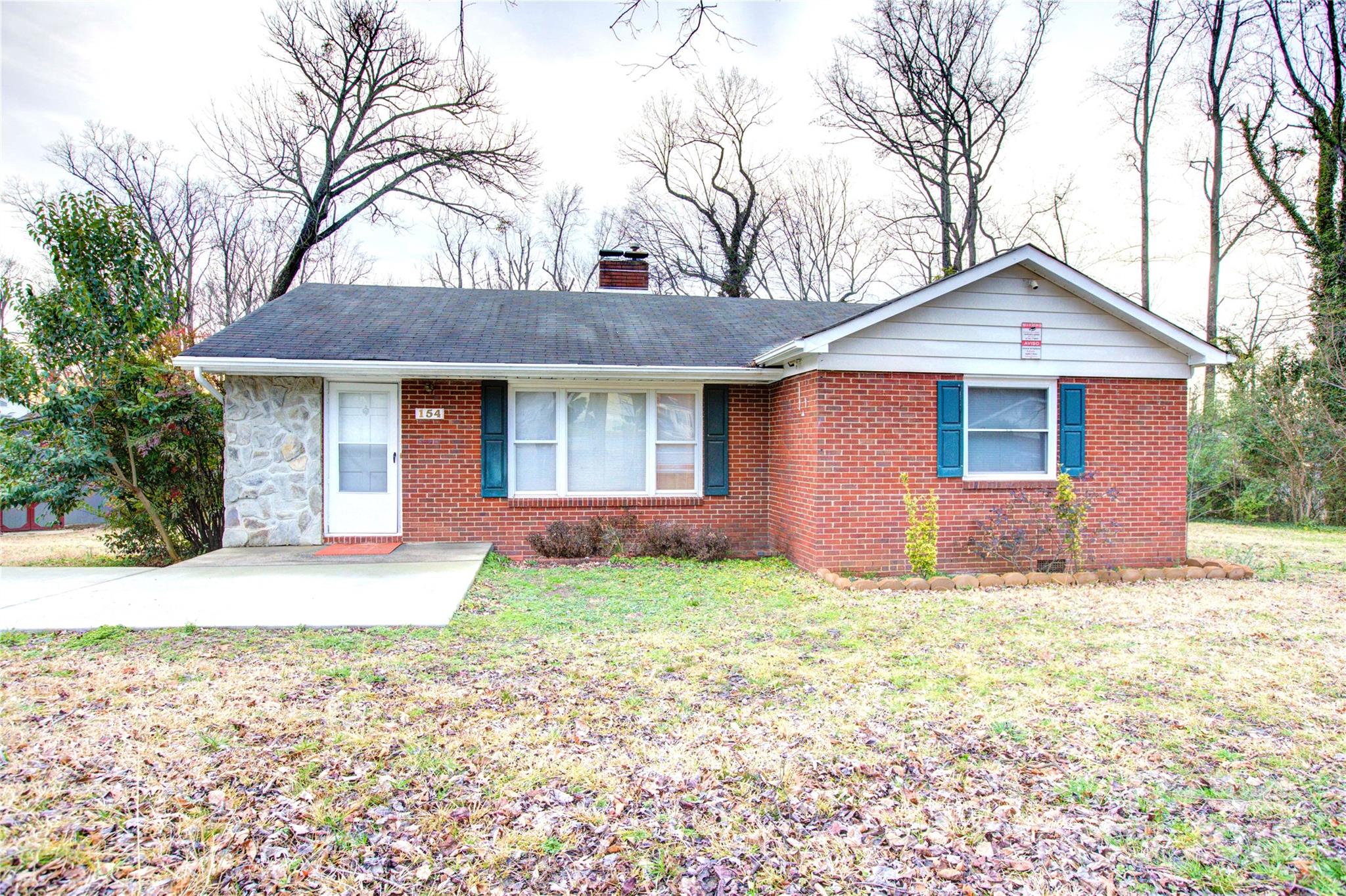 Investors! Fabulous Location...minutes from uptown Charlotte! Largest lot in neighborhood at 0.49 acres. This full brick home has 3 bedrooms/1 bath. Original hardwoods throughout and updated tile in bathroom. Giant 500 sq. ft. detached storage building and MORE! Great home...lots of potential! Fireplace "as is."
