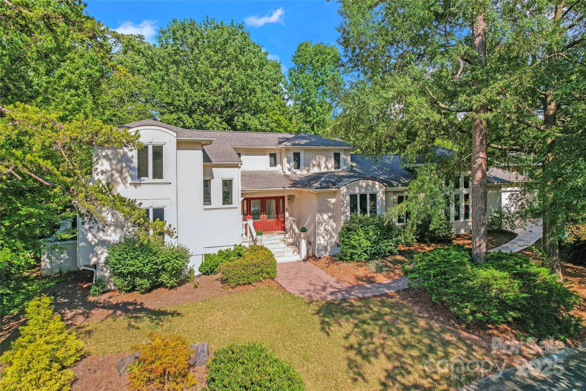 Located on a quiet corner cul-de-sac in the Lake Wylie community of River Hills, 35 Heritage Drive offers a comfortable blend of privacy, thoughtful updates, and everyday livability. Set back from the road and surrounded by mature landscaping, the home feels tucked away while still being part of an active, amenity-rich neighborhood.

Inside, the open floor plan features a primary suite on the main level, along with a spacious living area and an additional family or bonus room — providing flexible space for gathering, relaxing, or working from home. The kitchen offers granite countertops, generous cabinet space, and new appliances, and flows easily into the main living areas.

Recent updates include new interior paint, new flooring, and refreshed landscaping, along with extensive outdoor improvements. The fully fenced backyard includes an irrigation system for the entire property, new stone stairs and walkways, and a paved patio with hot tub and pergola (all can convey) — creating a comfortable outdoor space to enjoy throughout the year. The stamped concrete driveway and walkways add both function and curb appeal.

River Hills residents enjoy access to walking trails, lake access, marina, beach area, tennis courts, playgrounds, and 24-hour security, with optional country club membership and golf available. The home is also located in the award-winning Clover School District.

A well-maintained home in a well-established community, offering both everyday comfort and access to the Lake Wylie lifestyle.